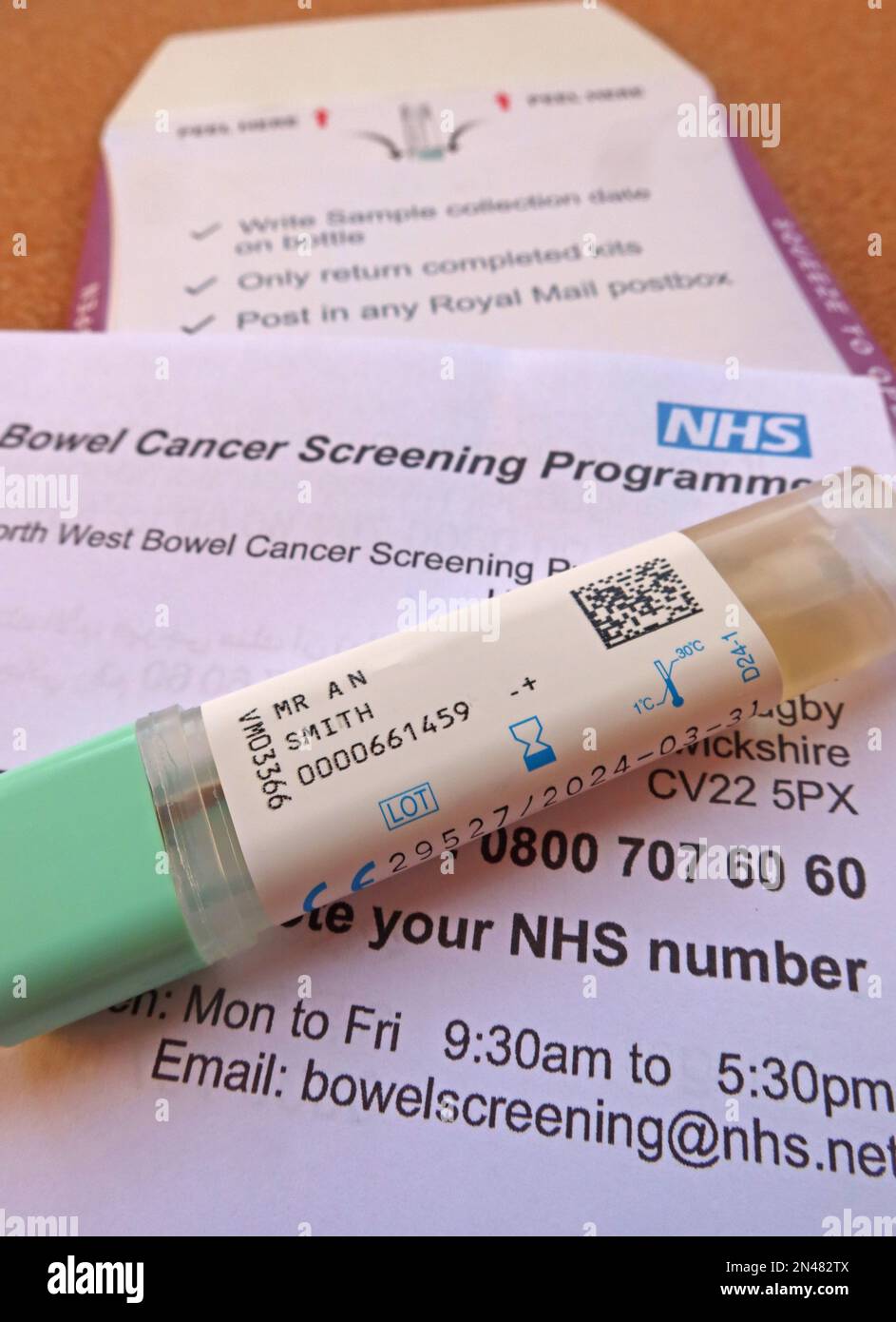 Early bowel cancer screening programme stool sample, QR coded, prepared and ready to post, North West England, UK Stock Photo