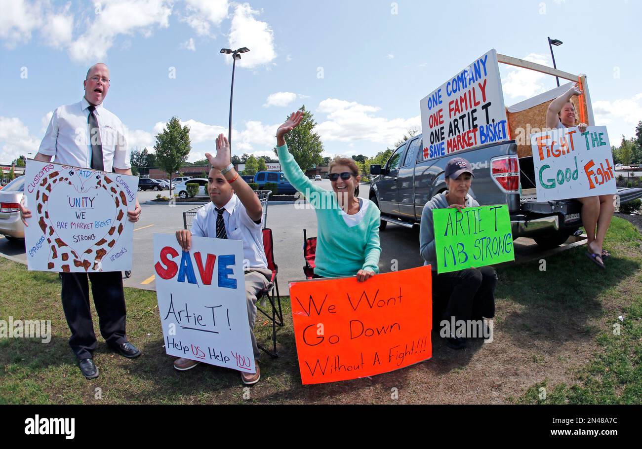 Market Basket employees, from left, Scott Gaff, Miguel Garcia