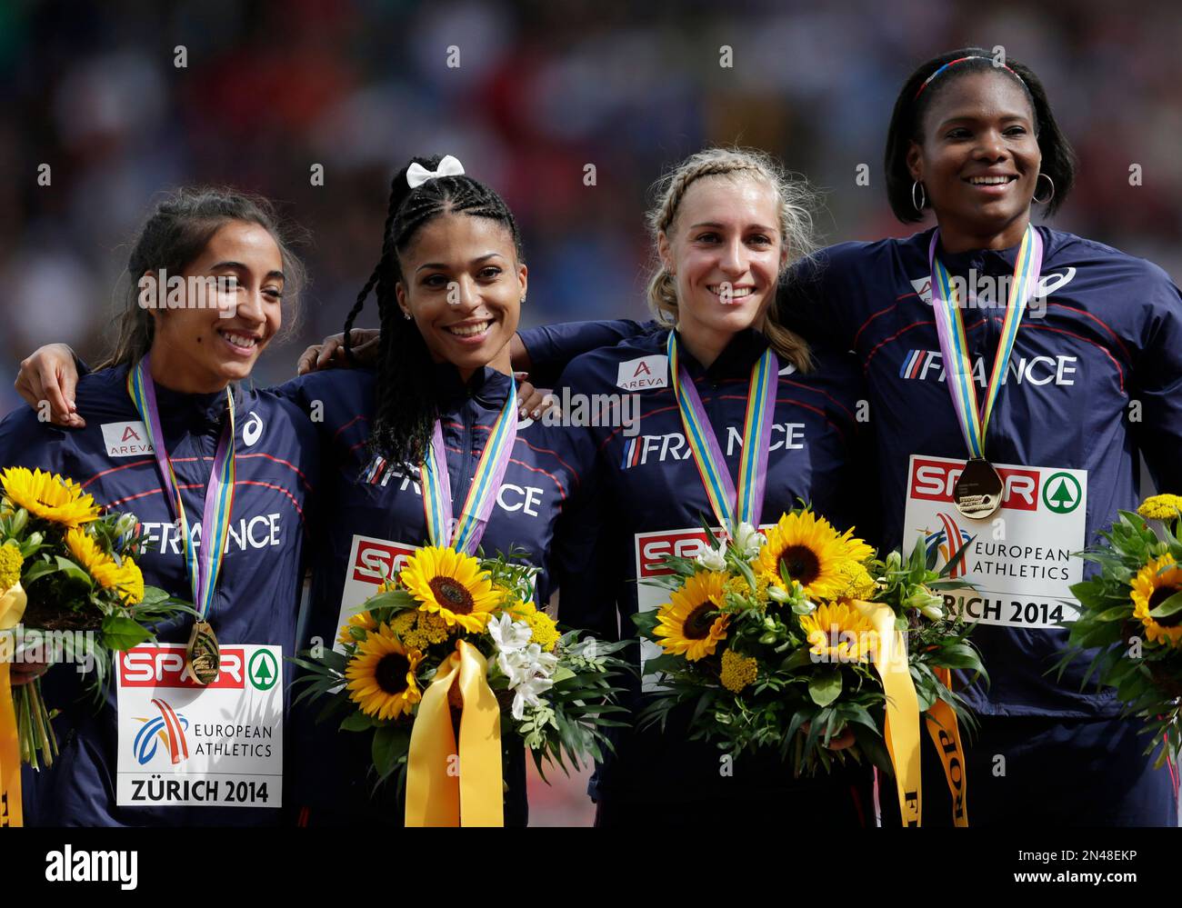 Team of France poses after winning the gold medal in the women's 4x400m