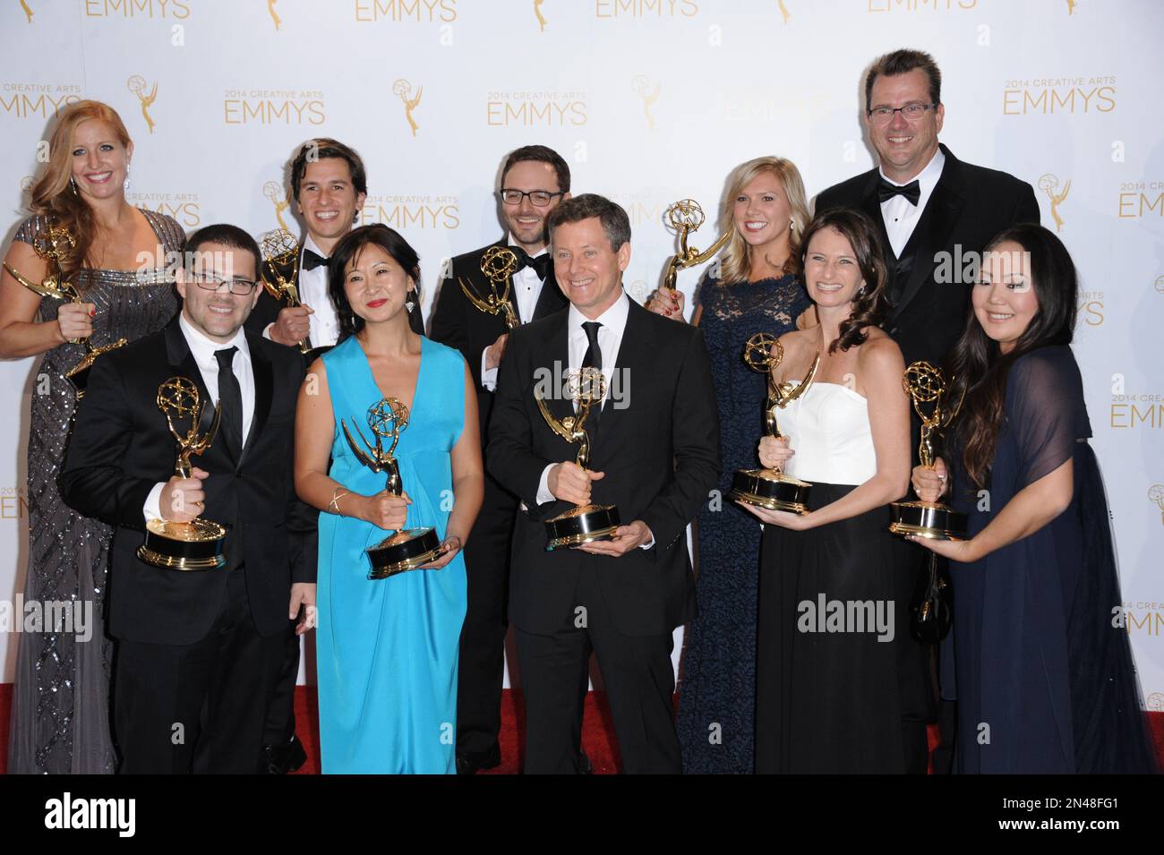 The cast and crew of “Shark Tank” pose in the press room with the award ...