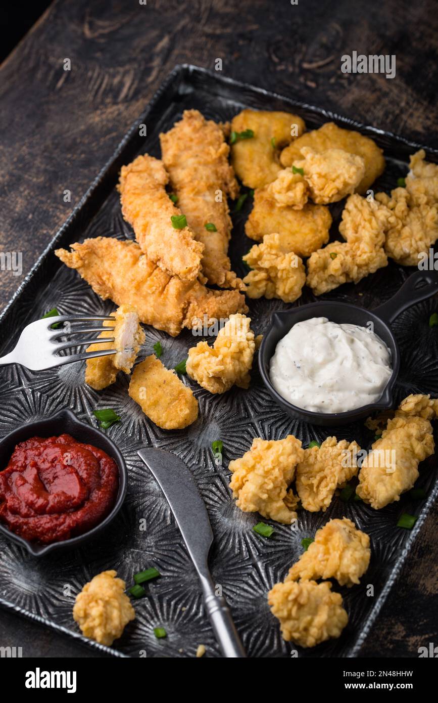 Chicken nuggets, strips and bites Stock Photo Alamy