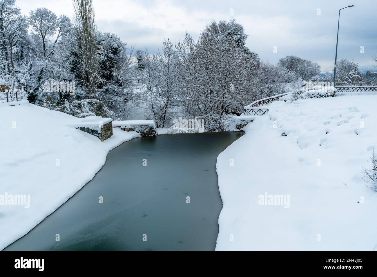 Frozen Artificial lake Snow winter white background blizzard frost