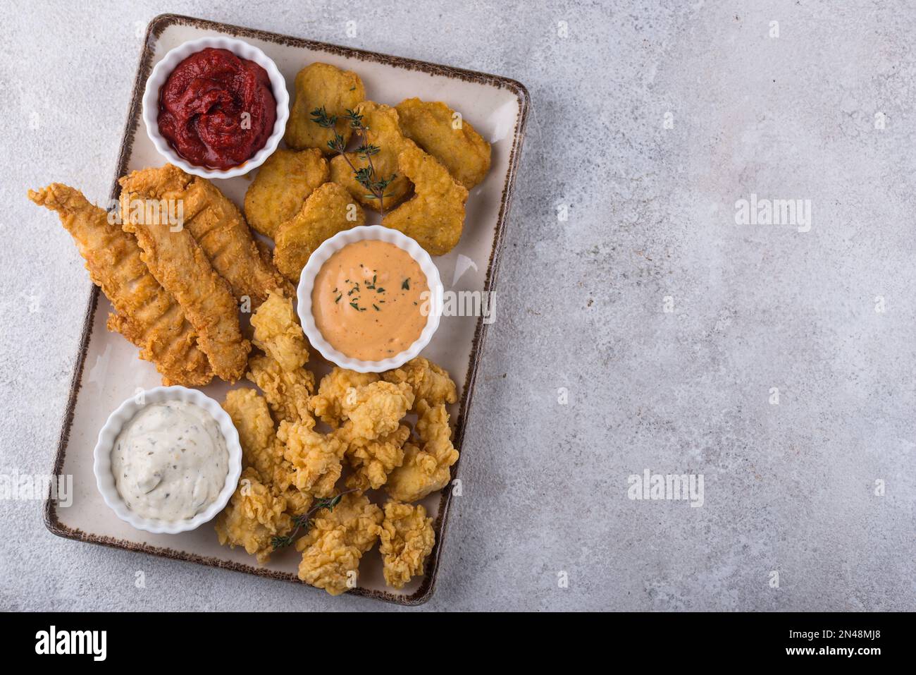 Chicken nuggets, strips and bites Stock Photo Alamy
