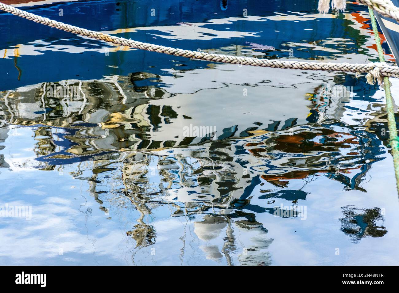 Killybegs fishing port, trawlers moored up. Reflections in sea, County Donegal, Ireland Stock Photo