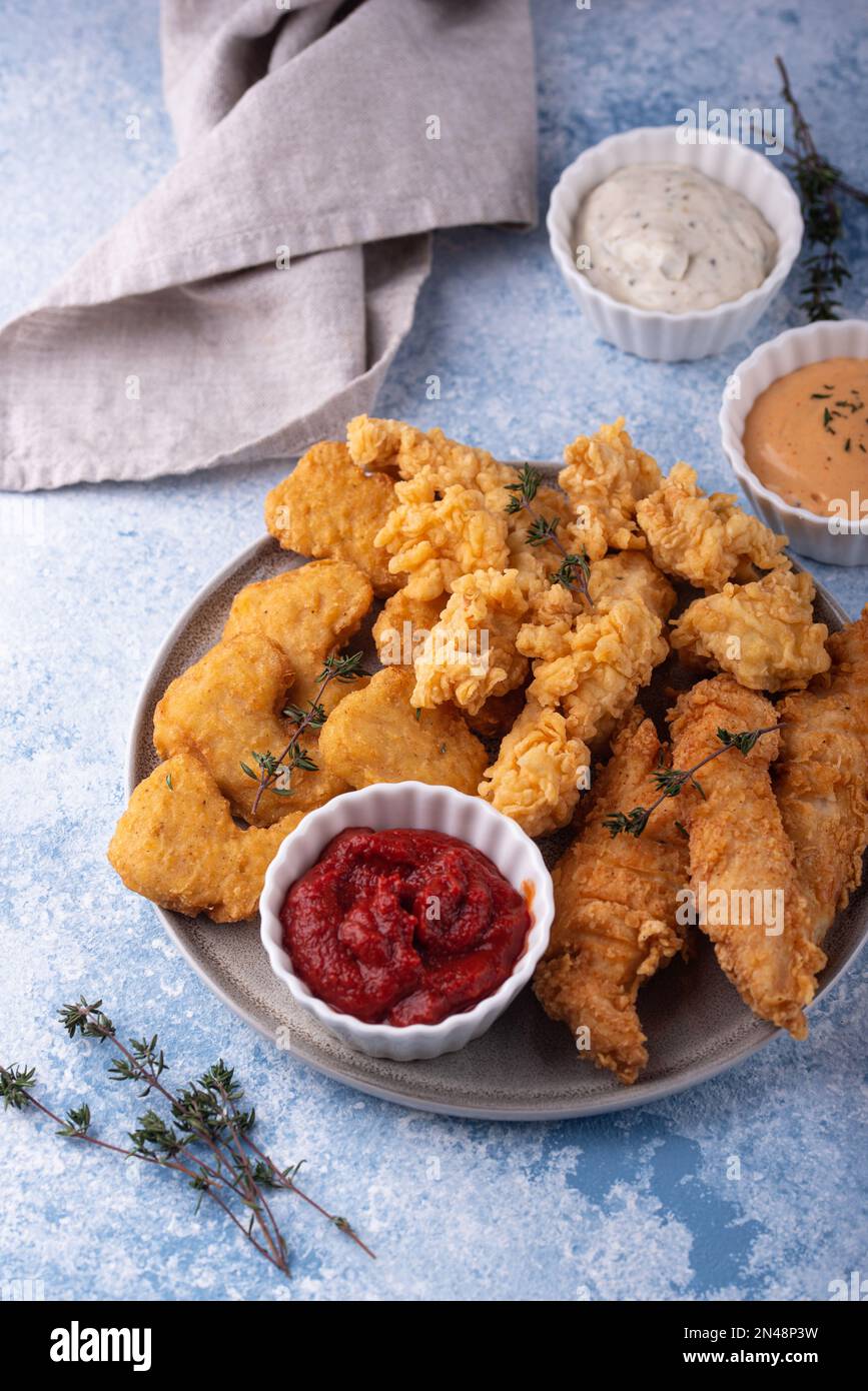 Chicken nuggets, strips and bites Stock Photo Alamy