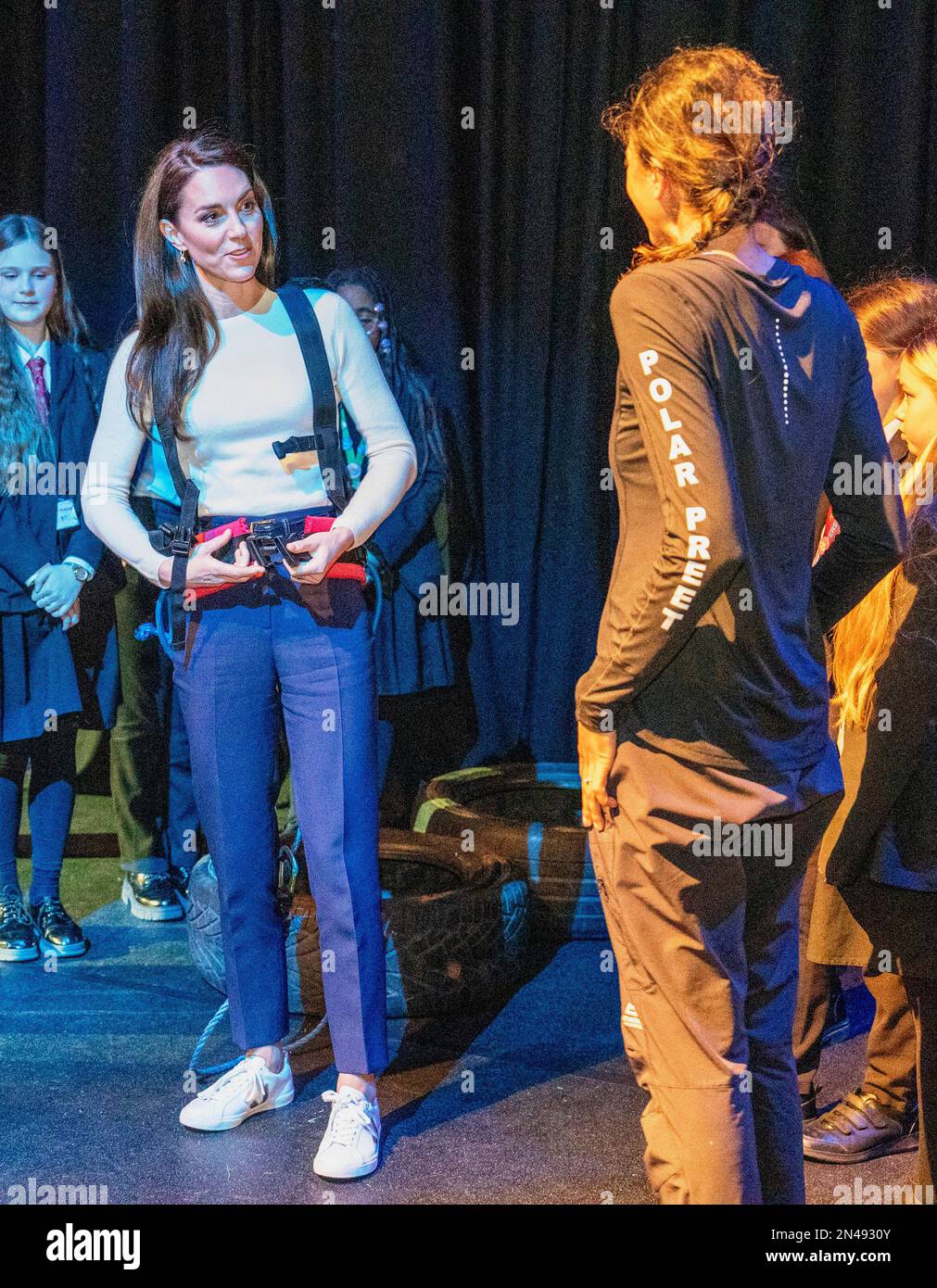 The Princess of Wales, talks to Captain Preet Chandi, as she prepares to pull tyres behind her, during a visit to Landau Forte College, in Derby, to celebrate Captain Chandi's return from her solo expedition across Antarctica. Picture date: Wednesday February 8, 2023. Stock Photo