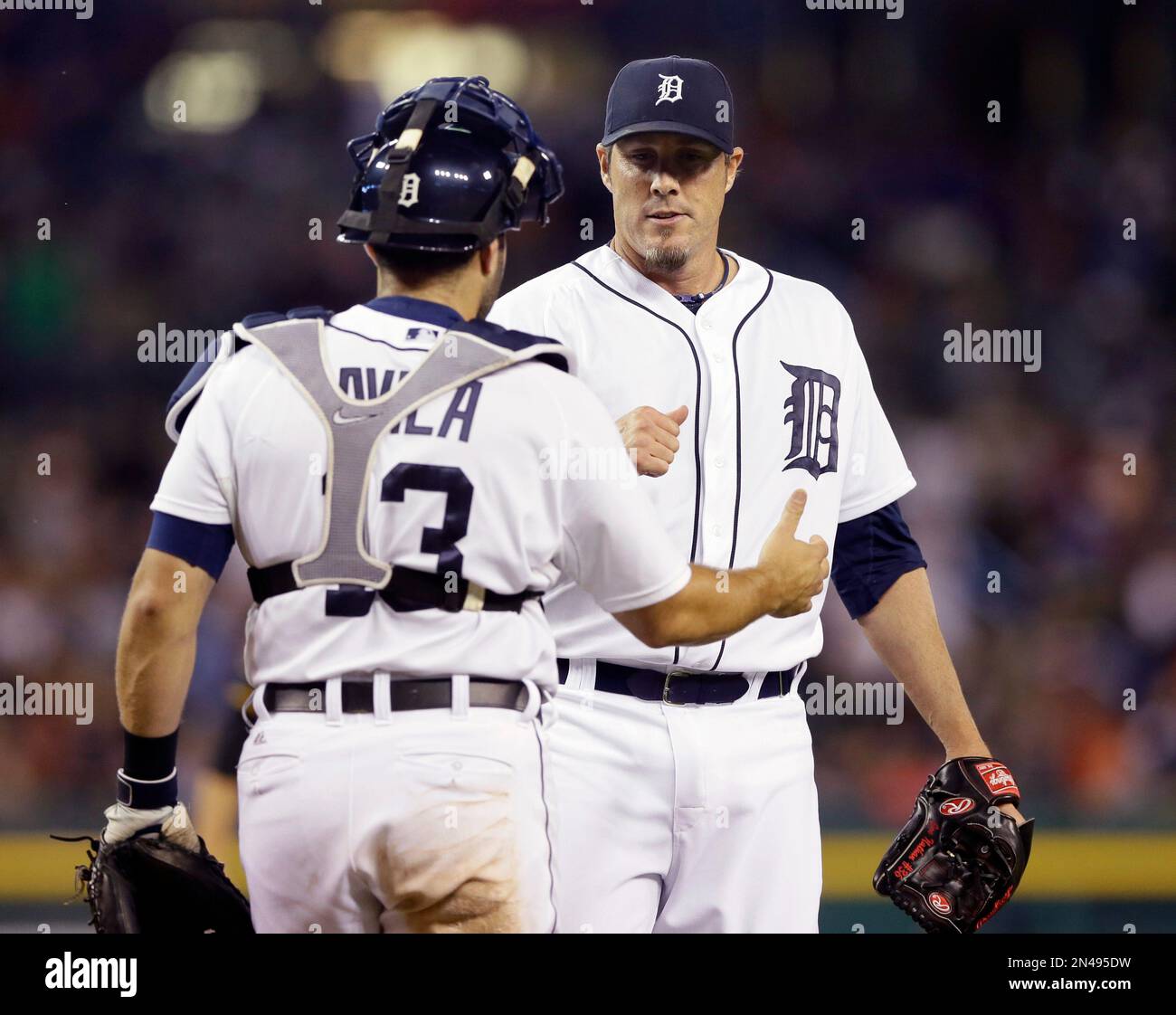 Detroit Tigers catcher Alex Avila and relief pitcher Joe Nathan shake ...