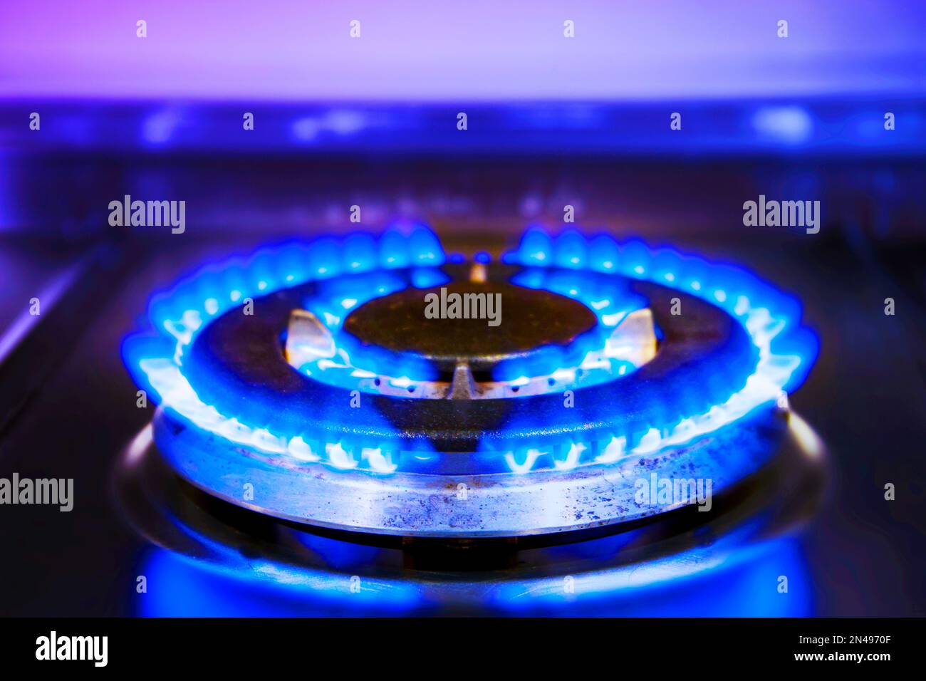 Burning blue gas flame. Burning kitchen gas stove. Gas stove lit
