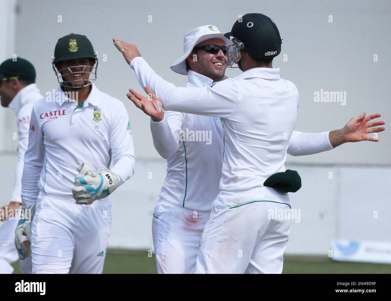 South African players celebrate the wicket of Zimbabwean batsman Regis