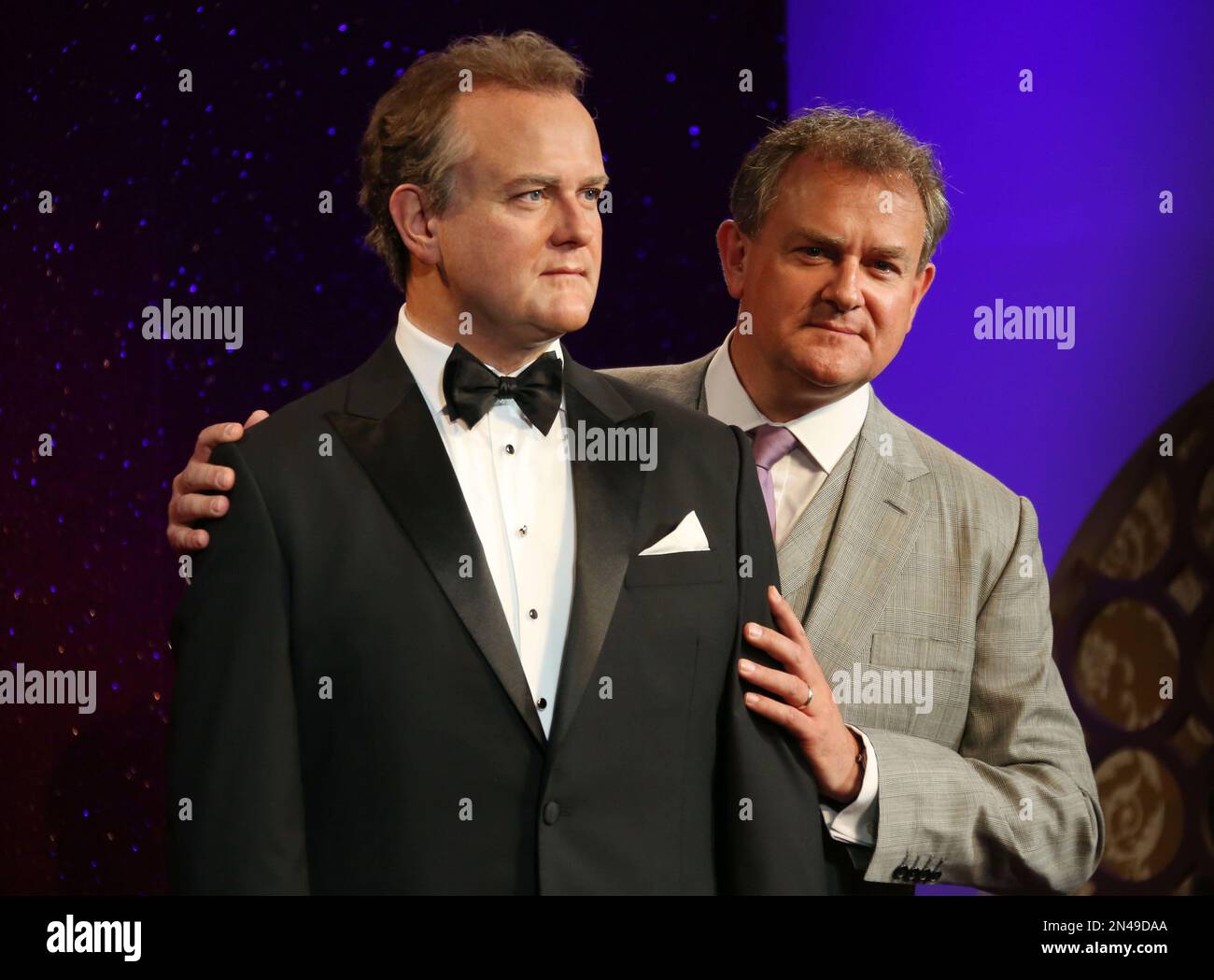 British Actor Hugh Bonneville Right Who Plays Downton Abbey S Lord Grantham Holds His Wax