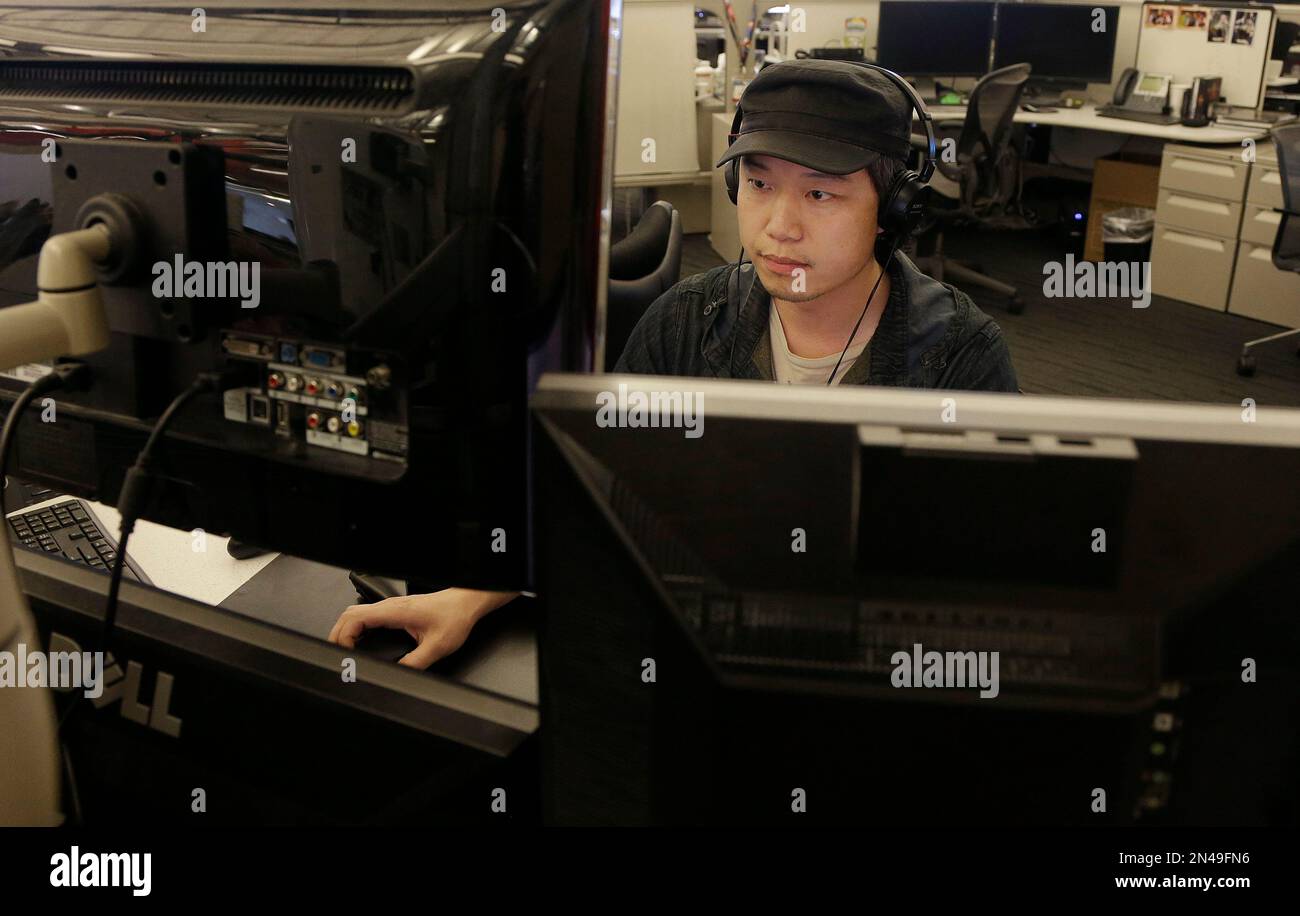 Game play programmer Tom Fong works at his station on the new "Call of