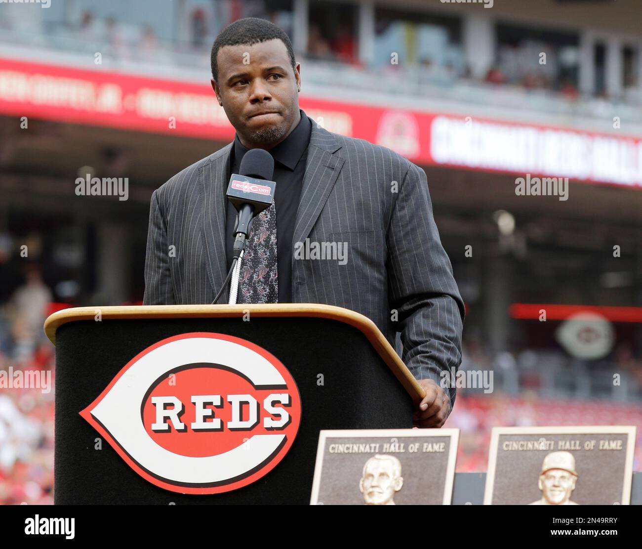 Ken Griffey Jr gets emotional and is conforted by his wife Melissa Griffey,  after seeing a video message from his son Trey Griffey, Saturday night at  Safeco Field in his induction to