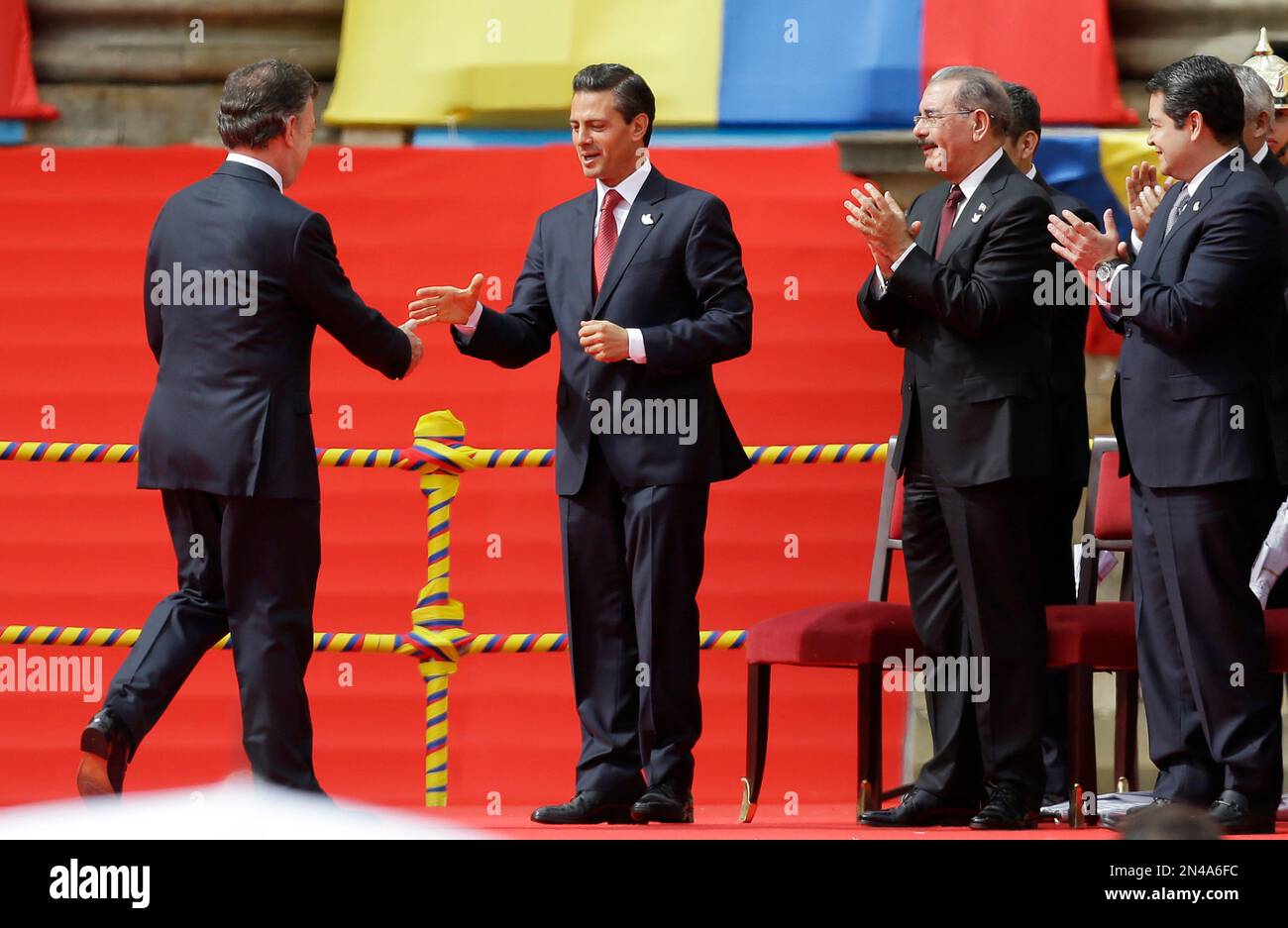 Colombia's President Juan Manuel Santos, Left, Shakes Hands With Mexico ...