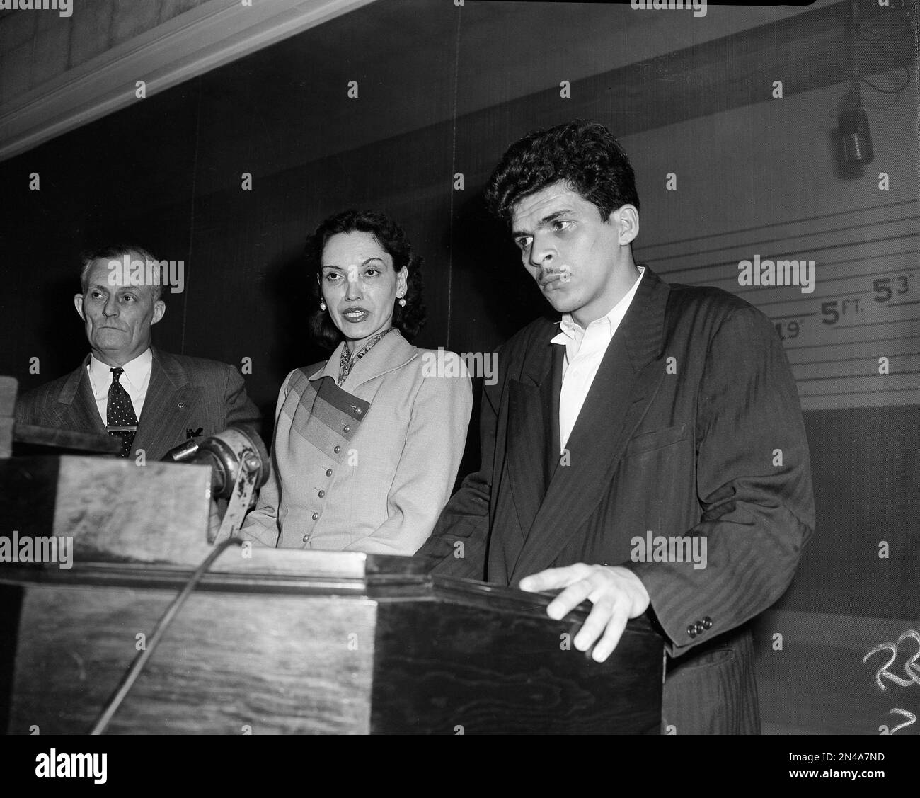 Lolita Lebron, center, one of four Puerto Rican nationalist extremists held  on $100,000 bail after an assault on the U.S. House of Representatives,  speaks to newsmen at police headquarters in Washington, D.C.,
