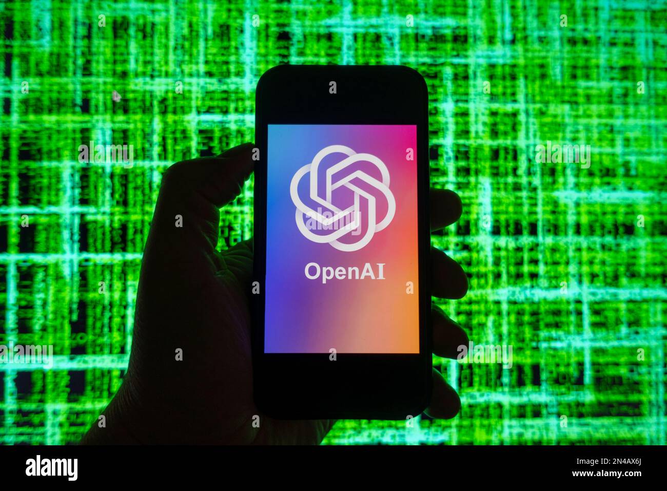 Digital composite image of OpenAI ChatGPT chatbot logo shown on mobile ...