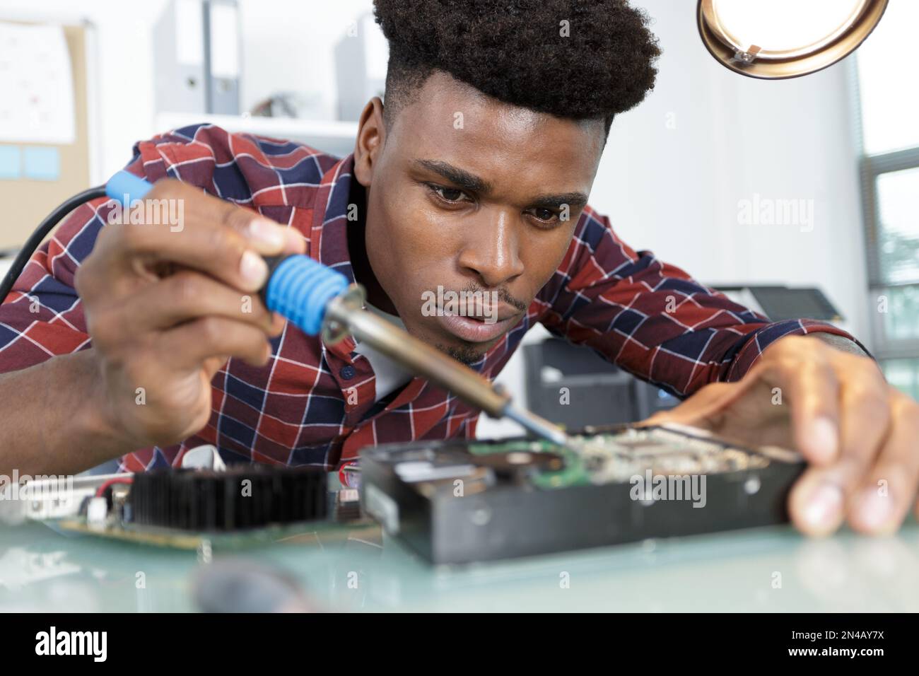 engineer fixing broken computer hard drive Stock Photo Alamy