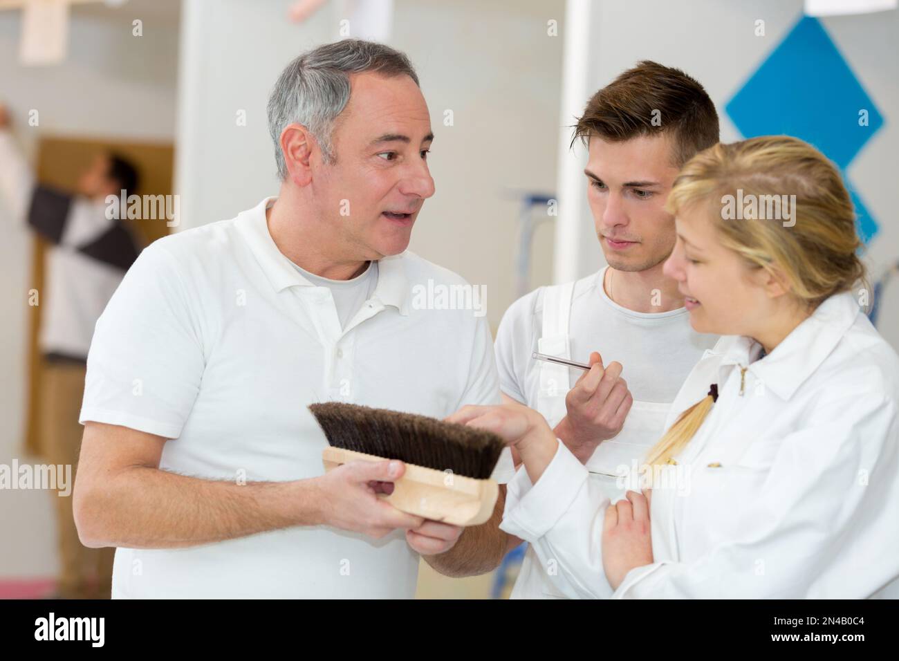 portrait of apprentices learning about brushes Stock Photo