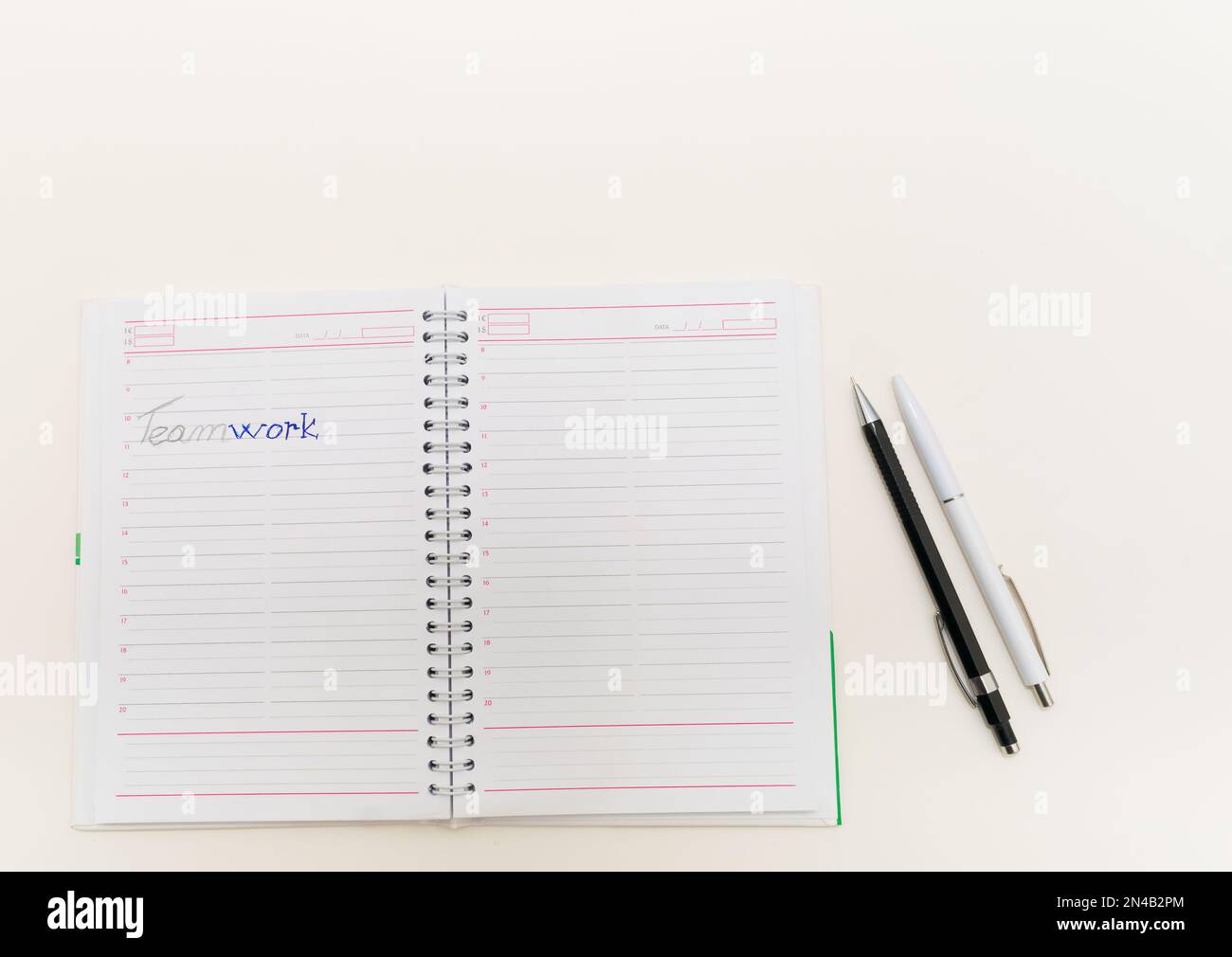 agenda on white background with pen and pencil Stock Photo