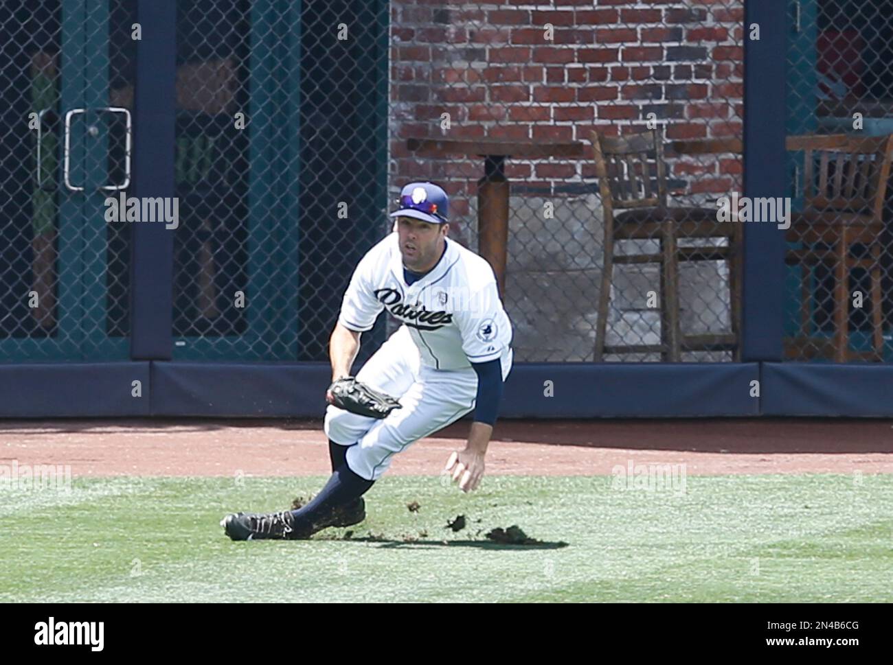 San Diego Padres left fielder Seth Smith slips while fielding a base hit in left field that