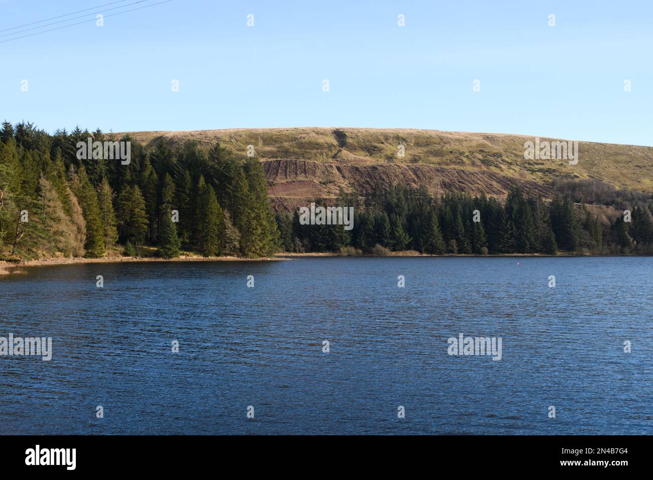 Pontsticill Reservoir, Merthyr Tydfil, South Wales, UK.  8 February 2023.  UK weather: Sunny scenes this afternoon.  Credit: Andrew Bartlett/Alamy Live News. Stock Photo