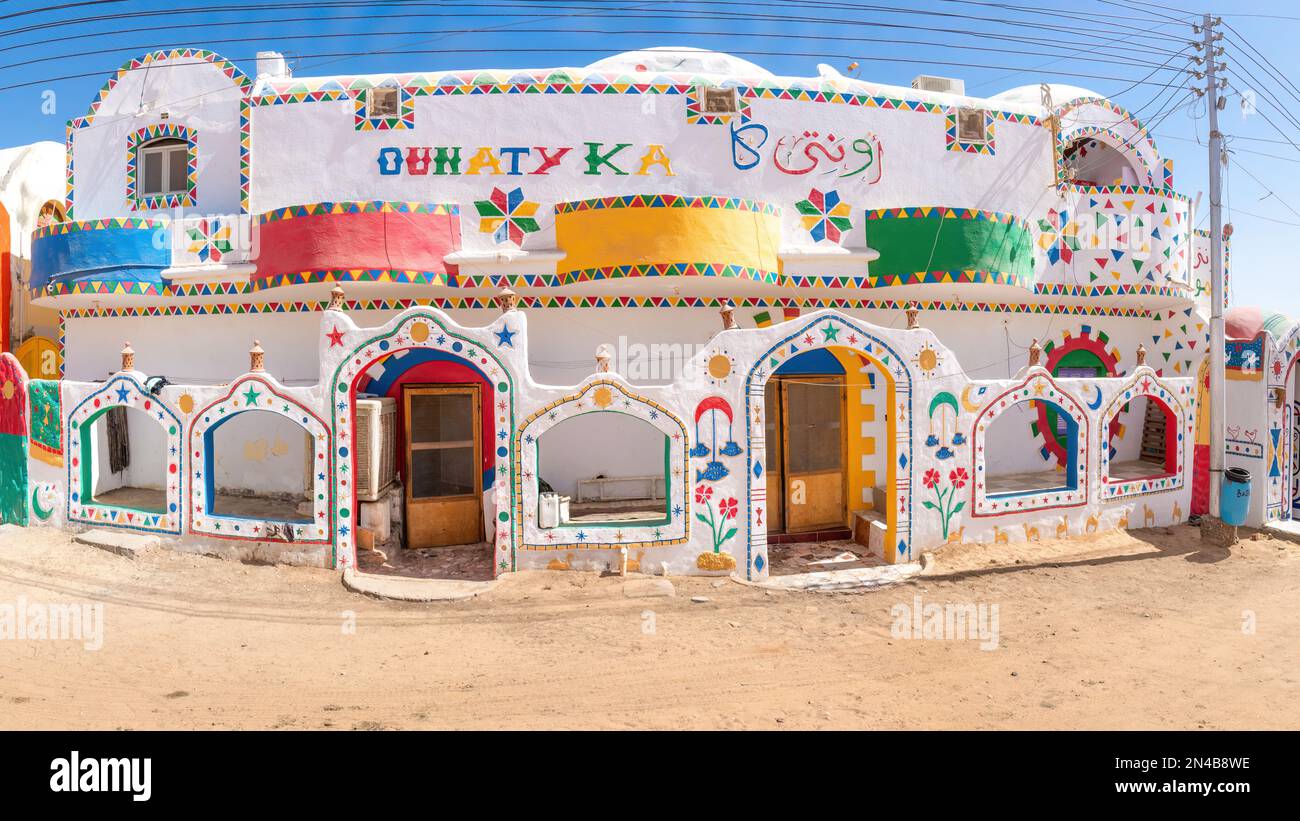 Aswan,Egypt; February 8, 2023 - Colourful Nubian houses in Aswan, Egypt Stock Photo