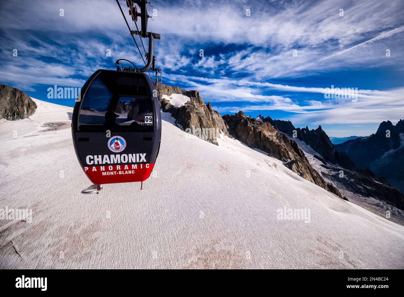 A cabin of the Panoramic Mont Blanc cable car between Aiguille du Midi and Pointe Helbronner crossing the Géant Glacier. Stock Photo