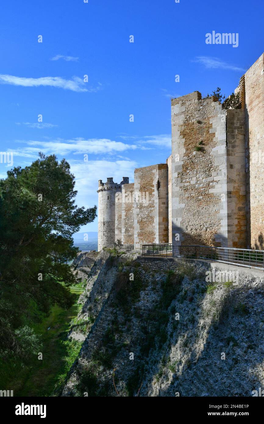 View of the outer walls of an imposing medieval castle of Lucera. It is located in Puglia in the province of Foggia, Italy. Stock Photo