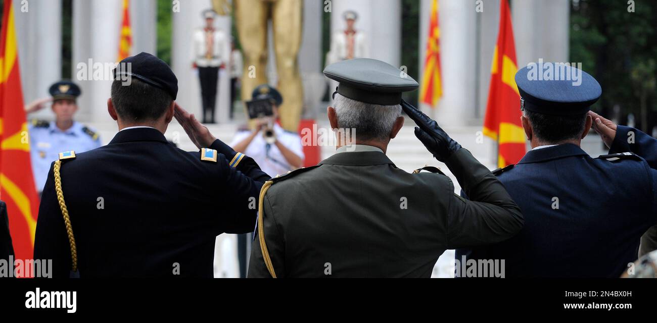 Foreign military representatives salute during a commemorative ceremony ...