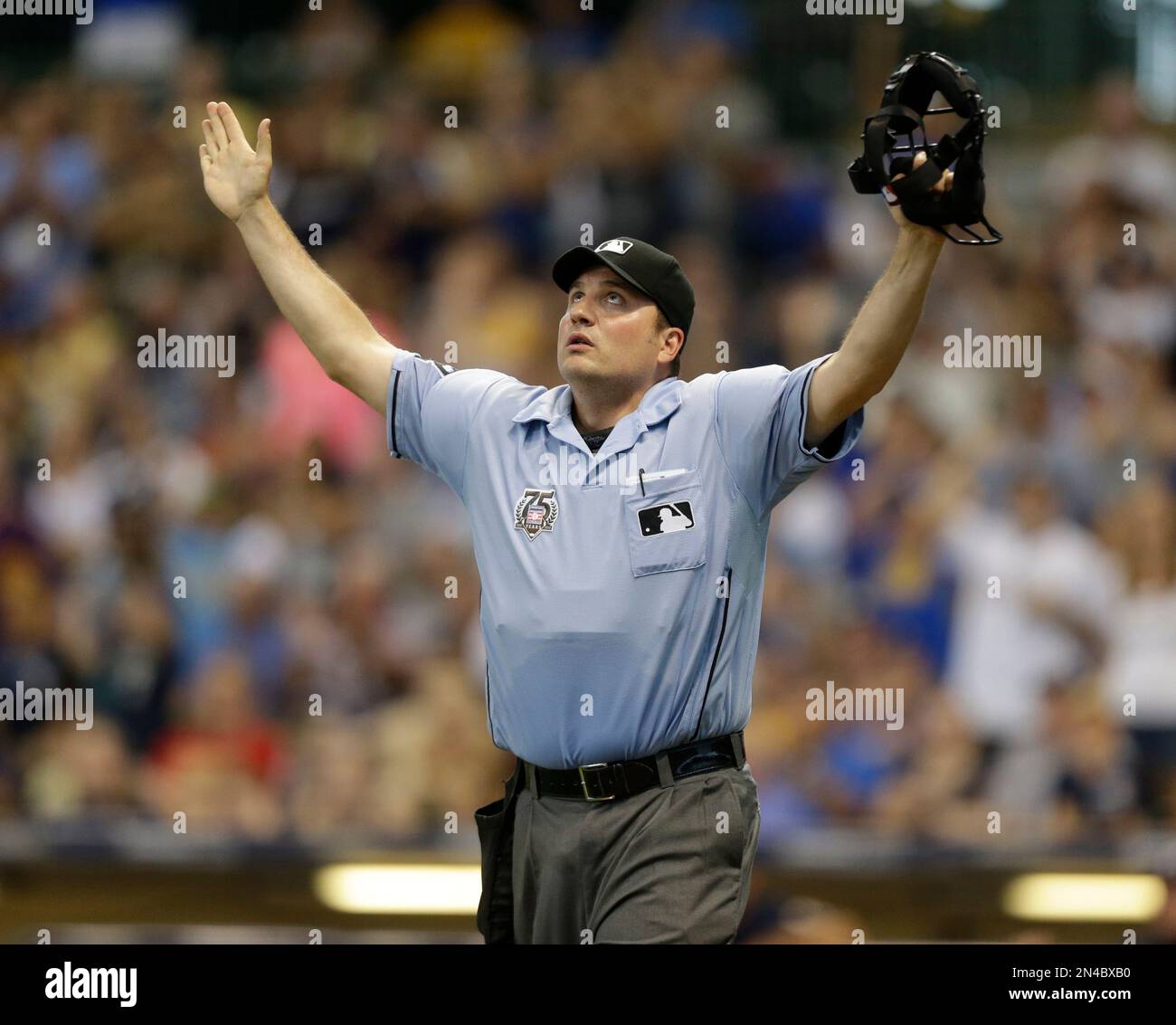 Home plate umpire Dan Bellino rules a foul ball off the bat of