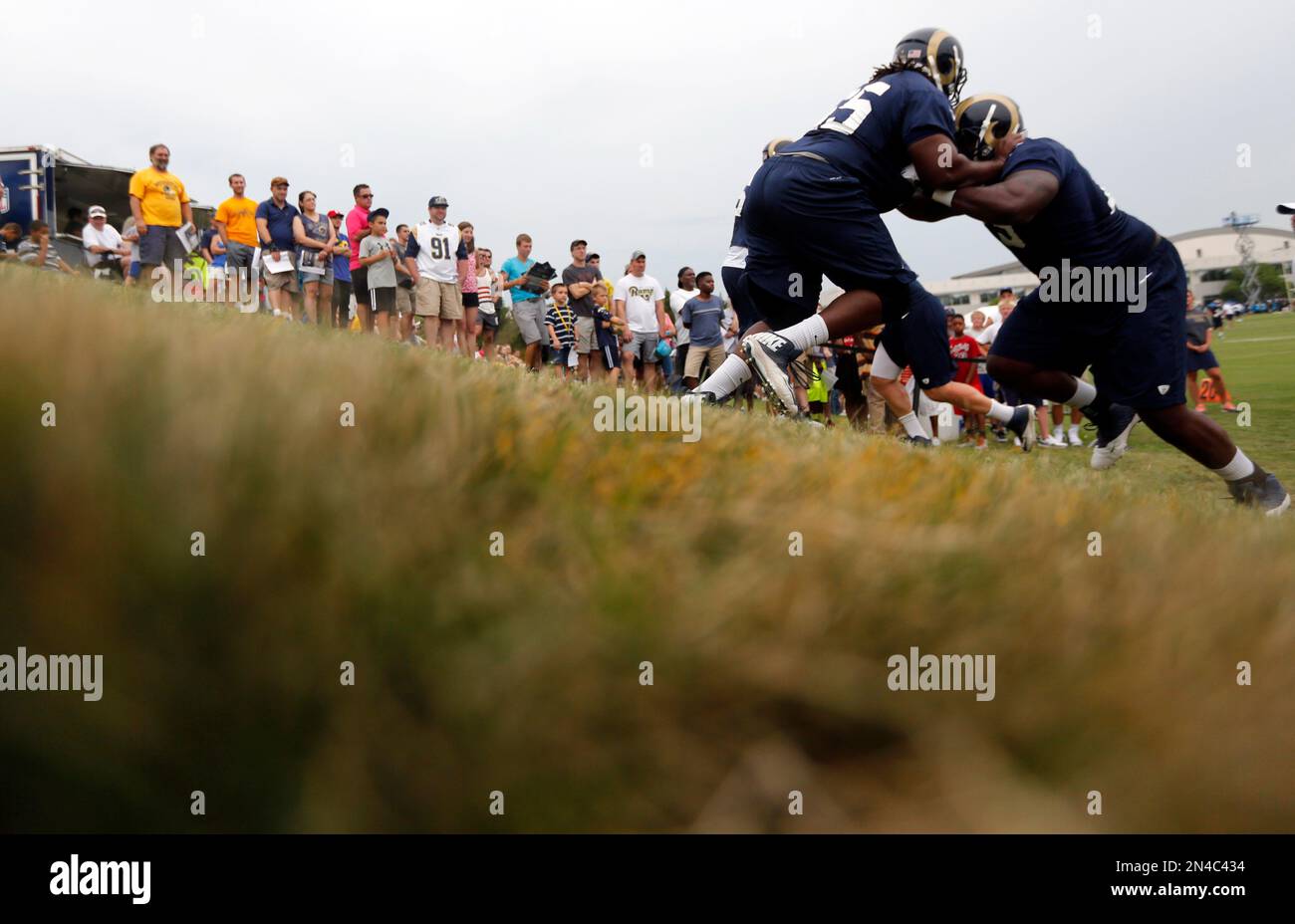 St. Louis Rams offensive tackle Greg Robinson, right, pushes Demetrius ...