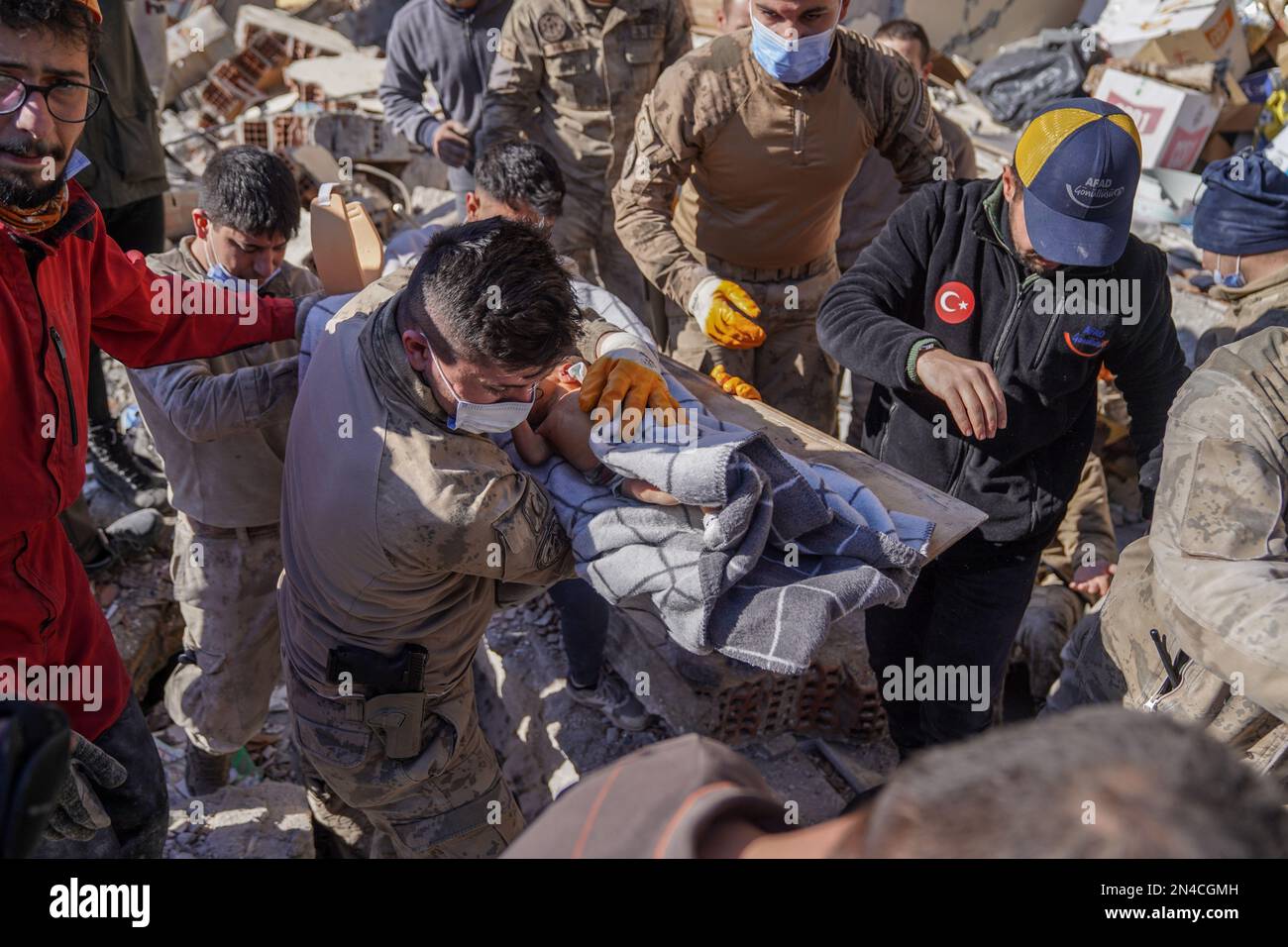 Hatay, Turkey. 08th Feb, 2023. Soldiers carry a 20dayold baby who was