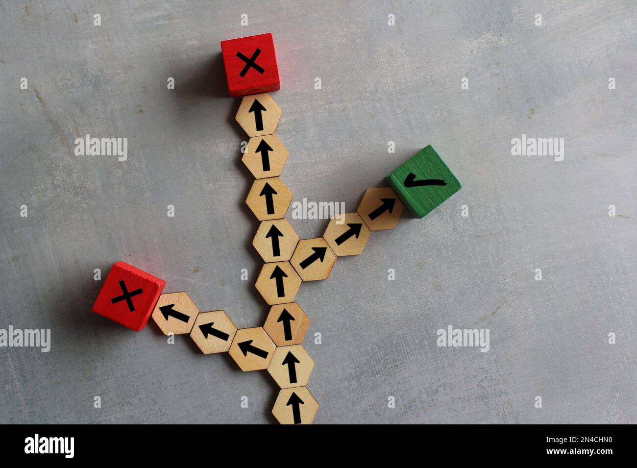 Wooden cubes with arrows, right and wrong icon. Choosing right path, road to success, alternative option concept Stock Photo