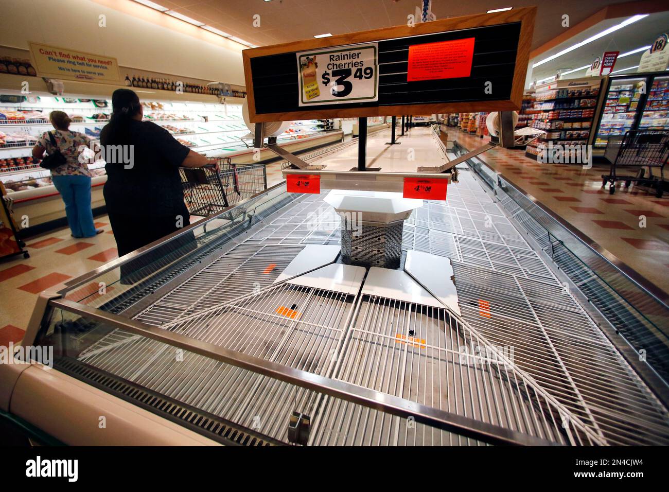 Shoppers encounter empty shelves as they shop at Market Basket in