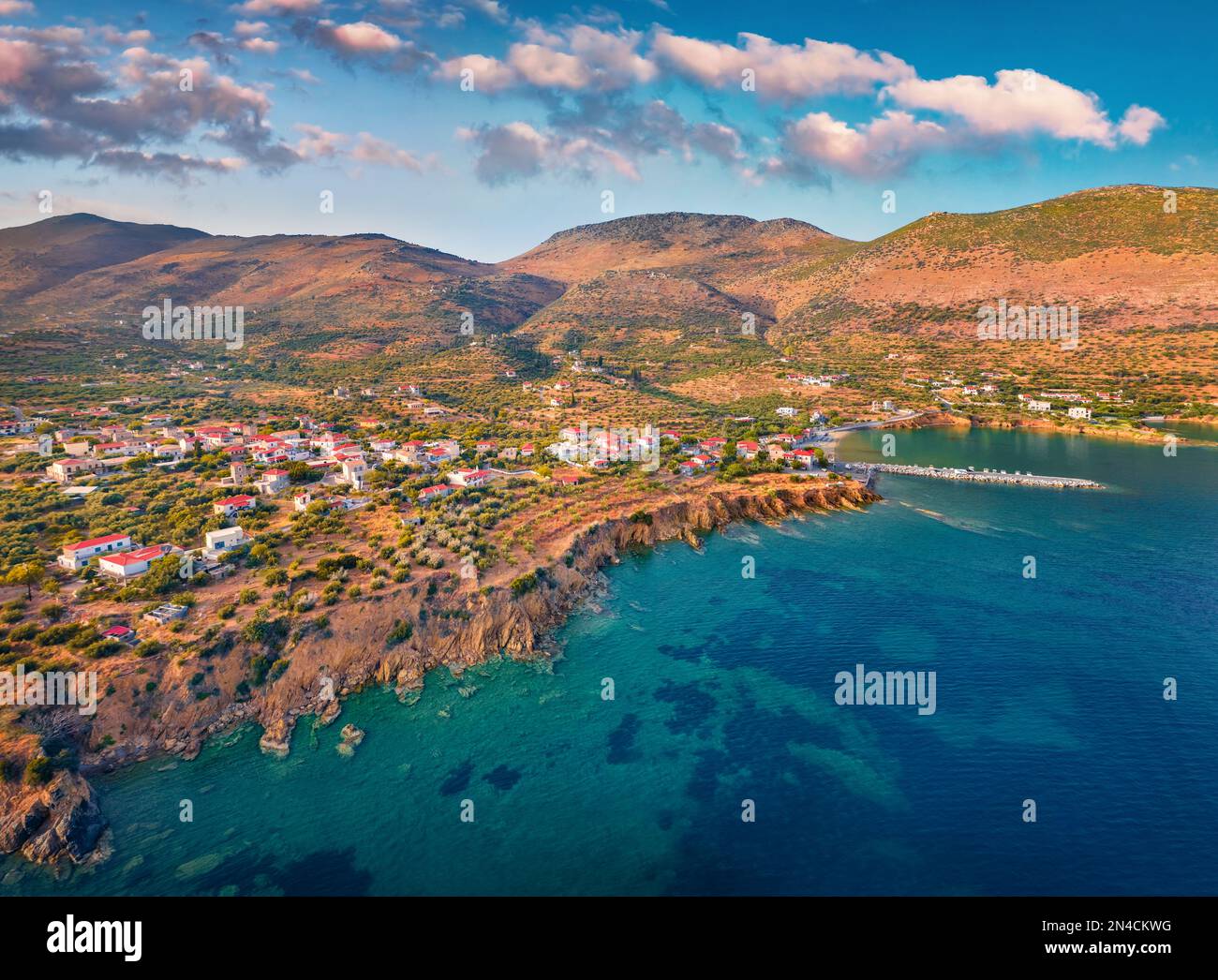 View from flying drone of Kotronas village. Captivating evening seascape of Mediterranean sea. Wonderful outdoor scene of Peloponnese peninsula, Greec Stock Photo