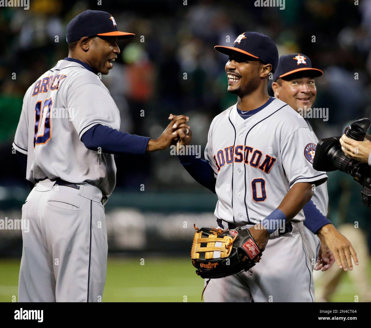 Houston Astros' L.J. Hoes, right, celebrates after his solo home run  against the Oakland Athletics during the 12th inning of a baseball game on  Tuesday, July 22, 2014, in Oakland, Calif. Houston