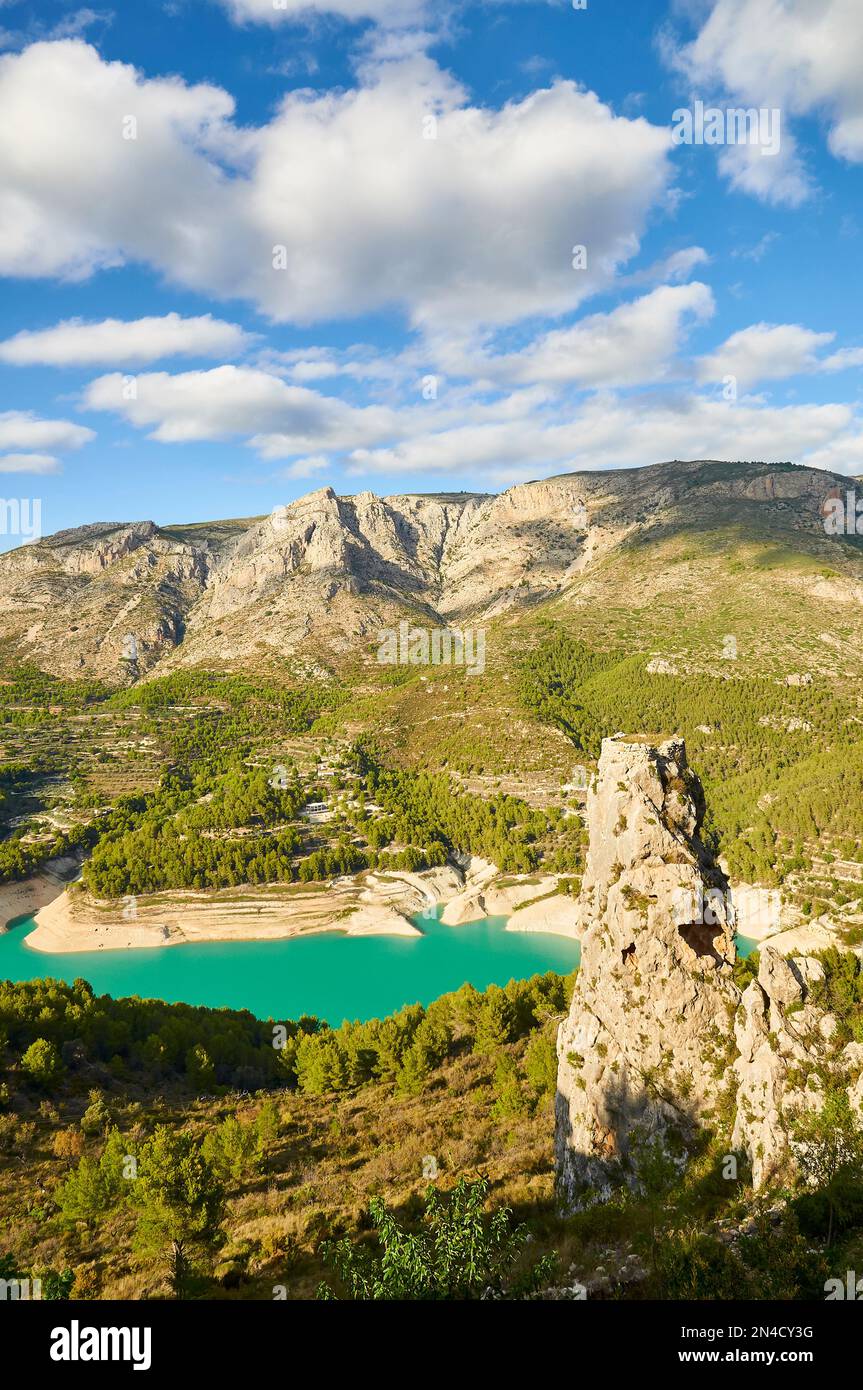Guadalest reservoir at sundown with its characteristic turquoise waters (Castell de Guadalest, Marina Baixa, Alicante, Valencian Community, Spain) Stock Photo