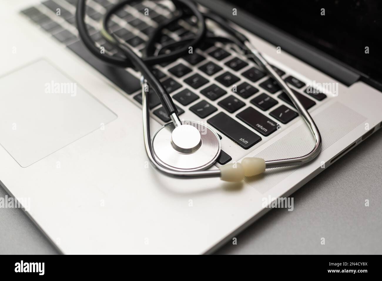 Stethoscope on the keyboard of laptop Stock Photo - Alamy