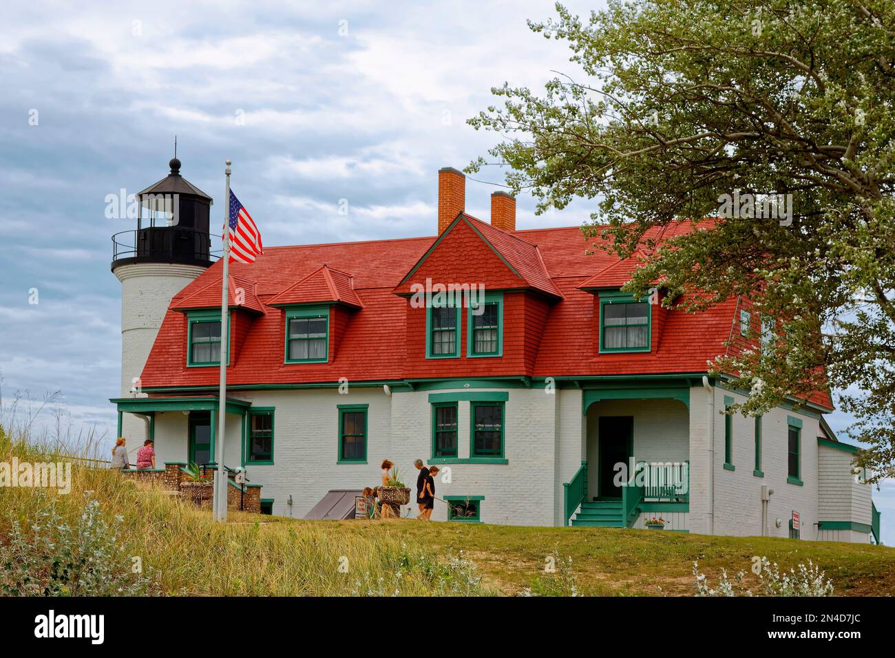 Point Betsie Lighthouse; 1858; aid to navigation; beacon, white, black top, people, keeper's house, red roof, National Register of Historic Places; Mi Stock Photo