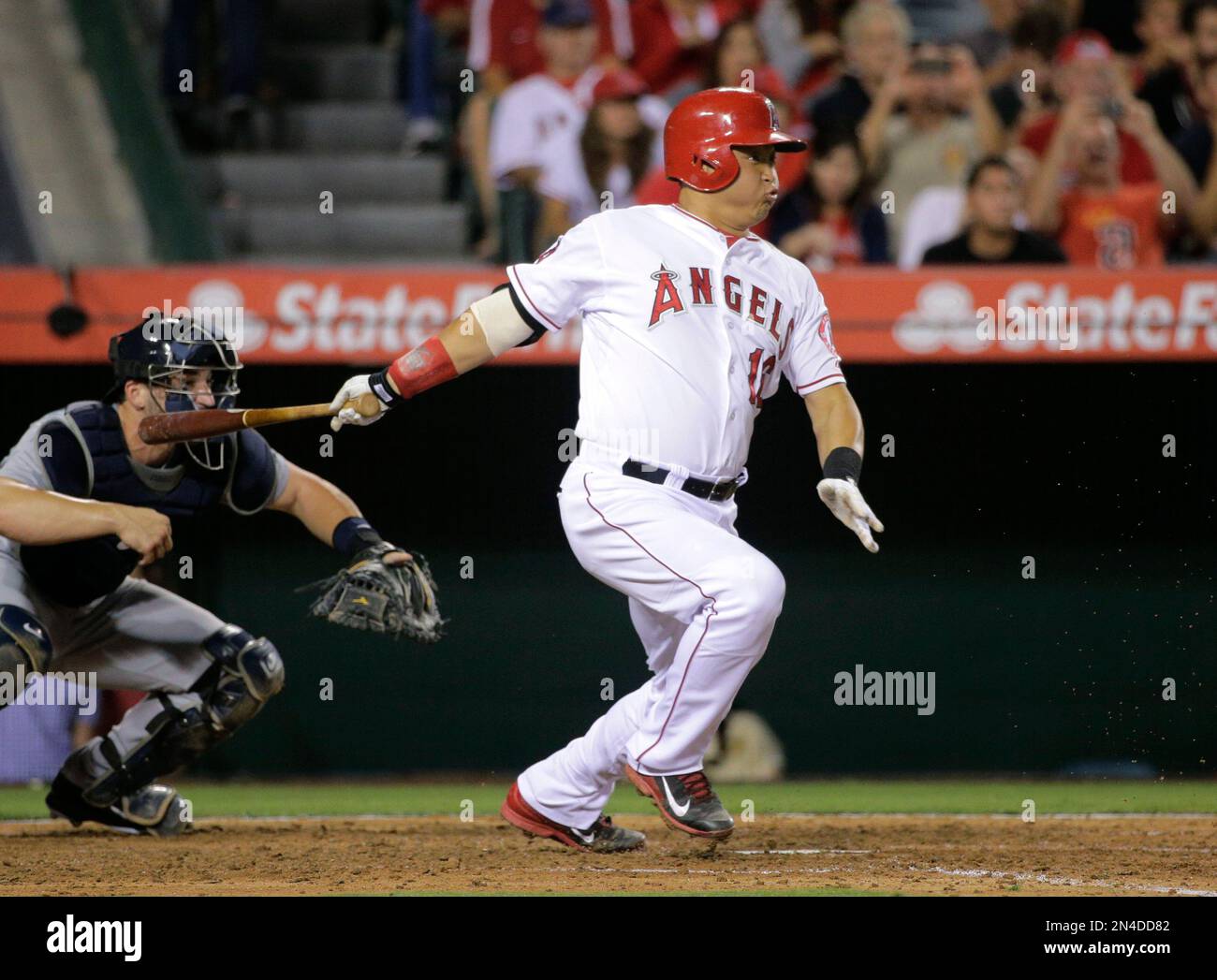 Los Angeles Angels' Hank Conger follows through on an RBI single during the fifth inning of a
