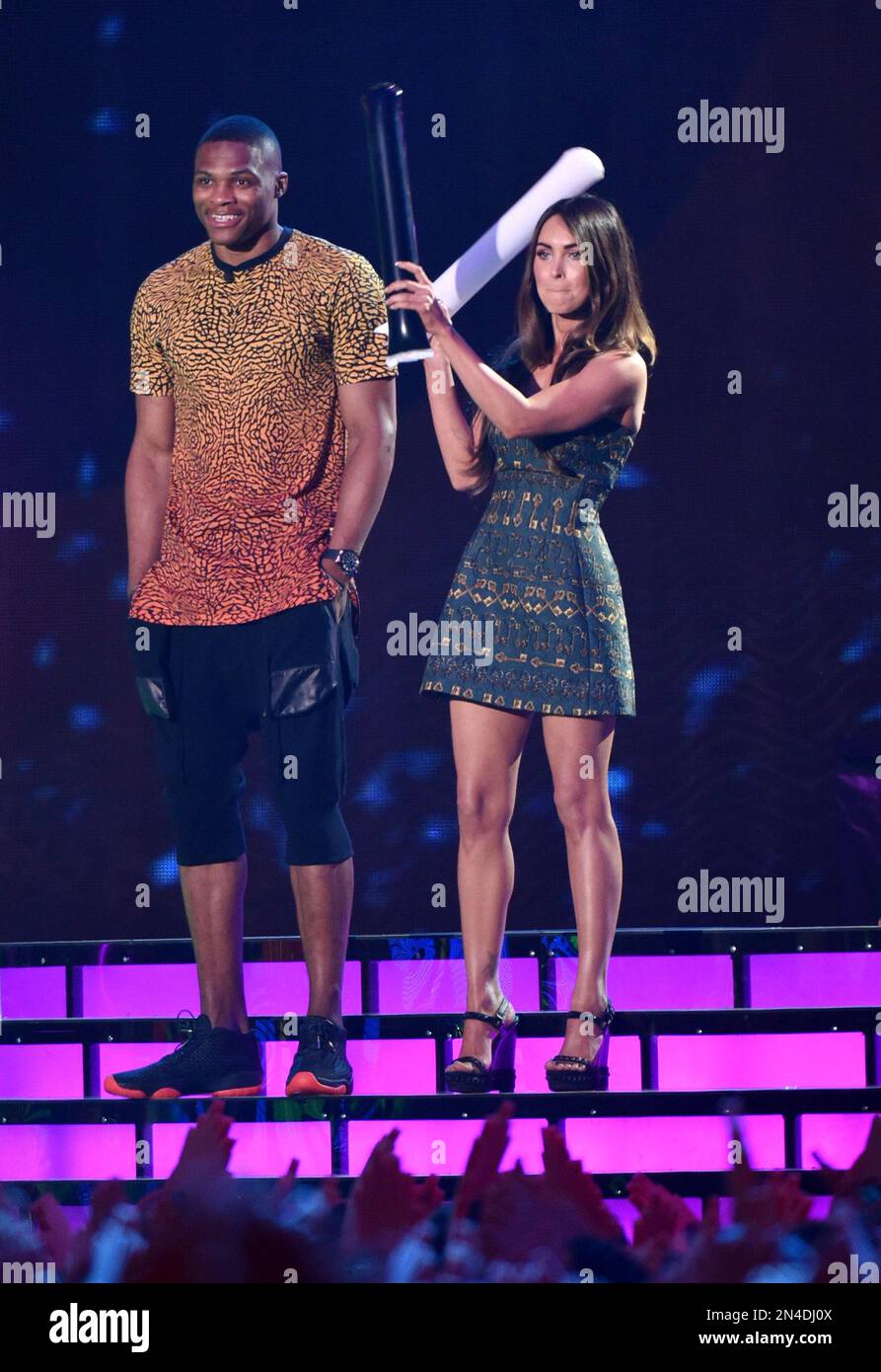 Russell Westbrook, left, and Megan Fox present the award for best
