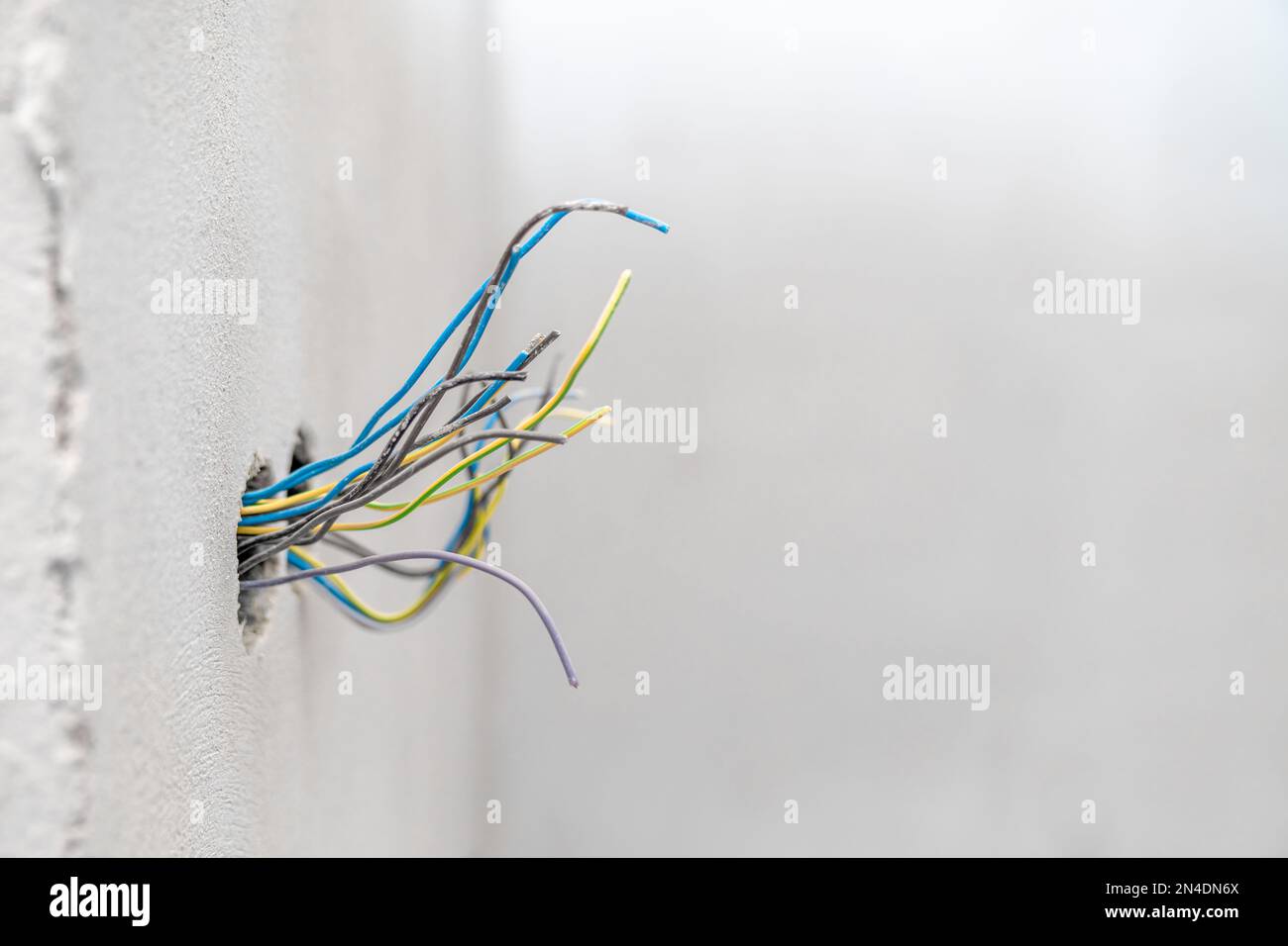 holes and wires in the wall for new sockets and switches Stock Photo Alamy