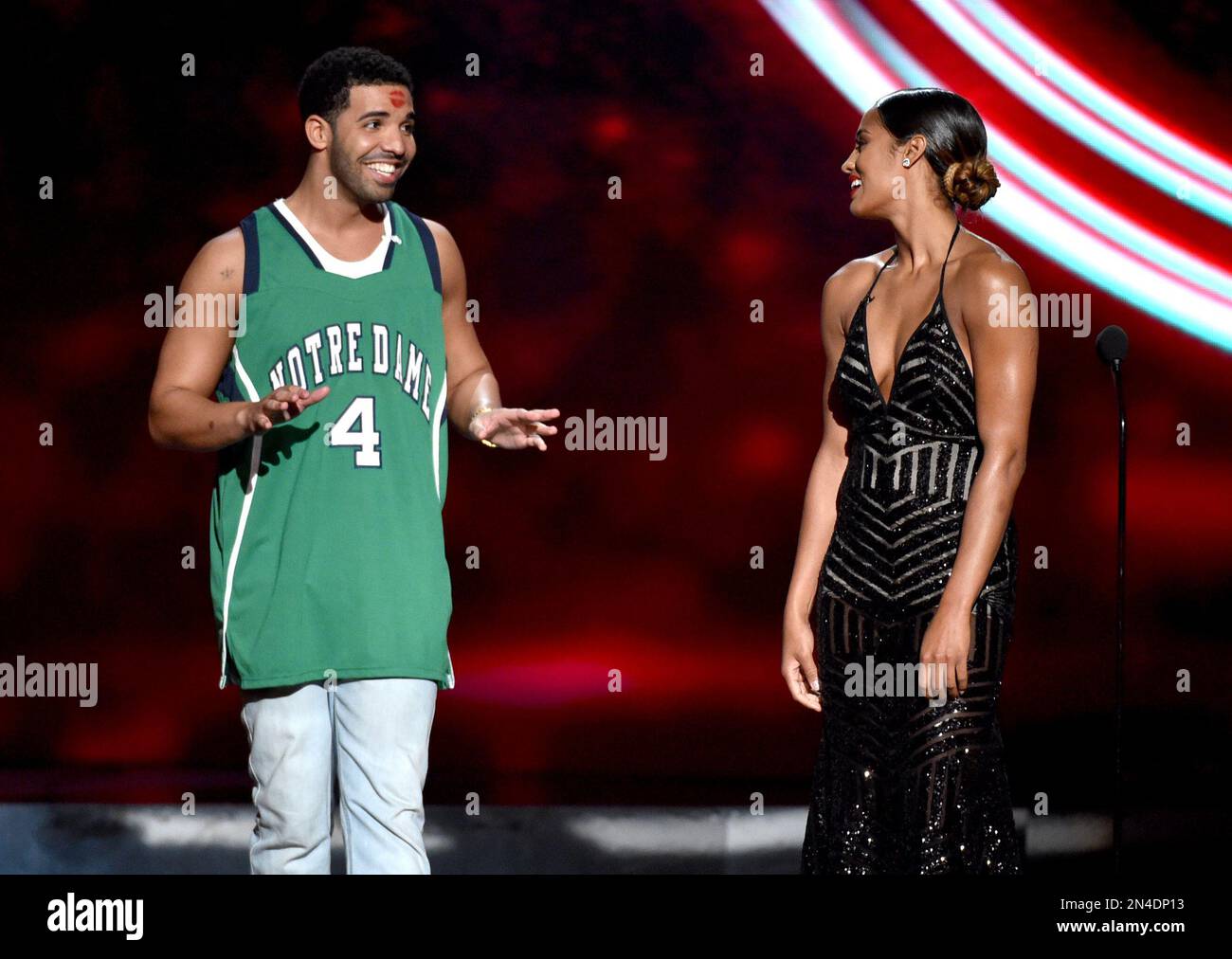 Skylar Diggins, right, smiles at Drake, left, who wears a Notre Dame ...