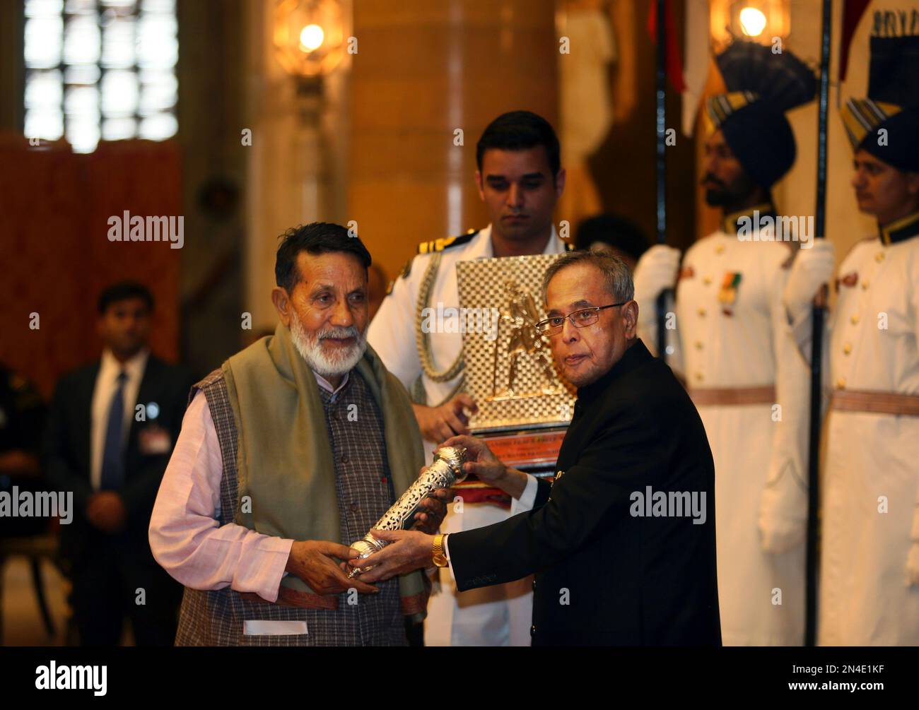 Indian President Pranab Mukherjee, right, confers Gandhi Peace prize to