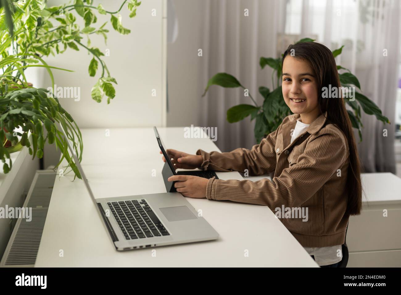 Smiling girl on videocall with guy, making video call to close foreign friend, talking by web camera, using virtual chat app online, long distance Stock Photo