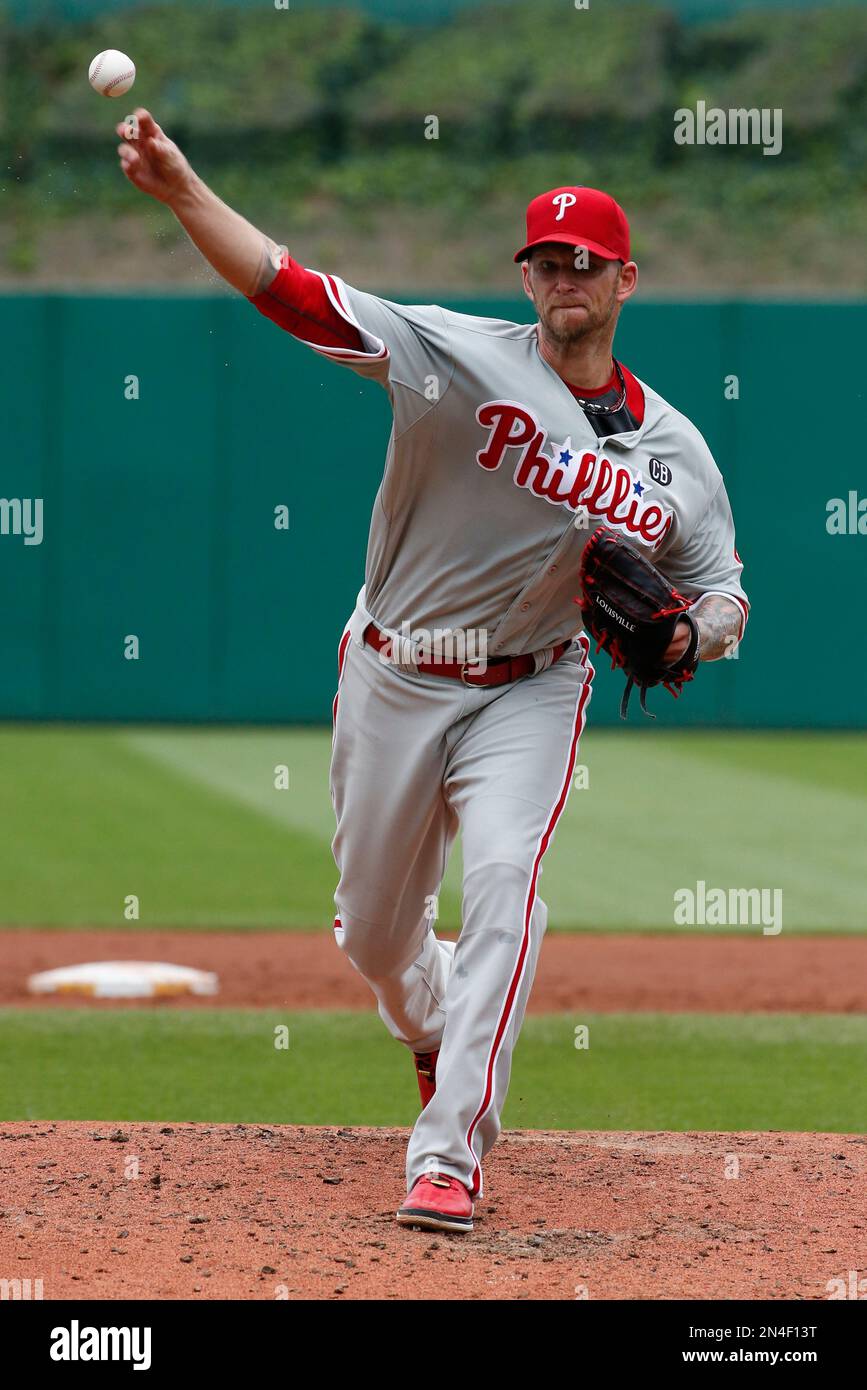 Philadelphia Phillies starting pitcher A.J. warms up before the