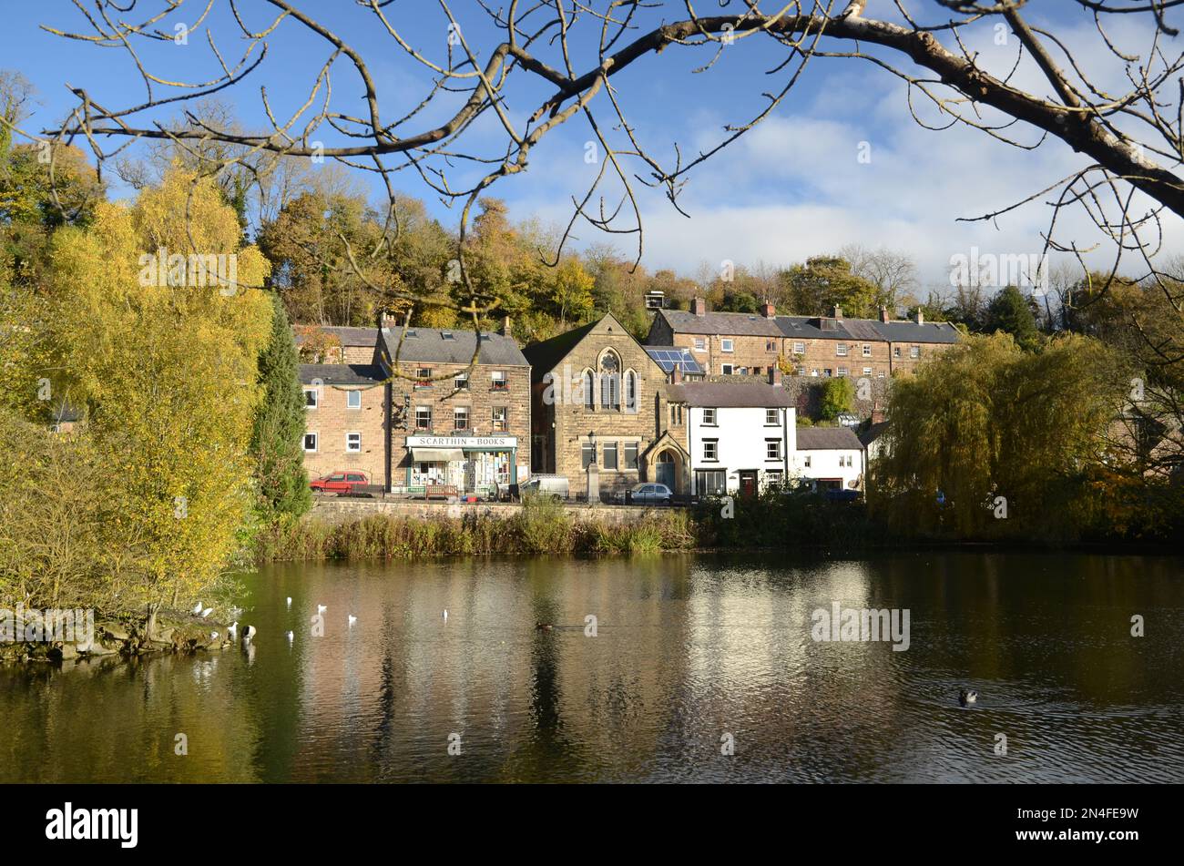 Looking accross Cromford mill pond towards Scarthin, Derbyshire, England Stock Photo
