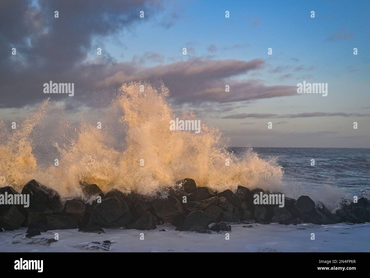 Agger, Denmark. 02nd Feb, 2023. In the light of the morning sun waves of the North Sea break on the west coast at the National Park Thy. The national park stretches from Agger Tange in the south to Hanstholm in the north. Credit: Patrick Pleul/dpa/Alamy Live News Stock Photo