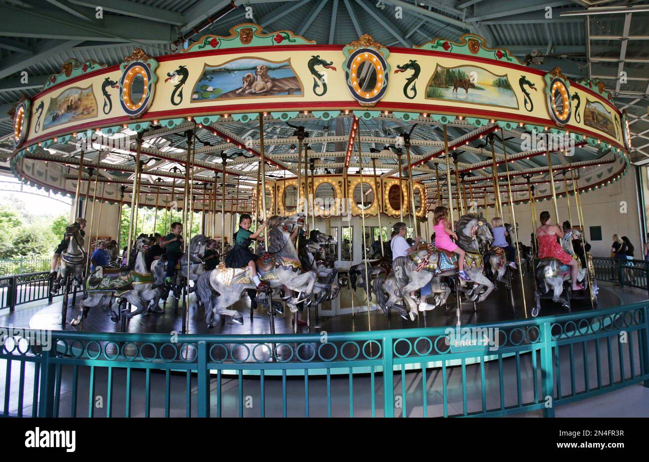 Como Zoo Rides In this photo taken Tuesday, June 3, 2014, visitors to the Como Town ...