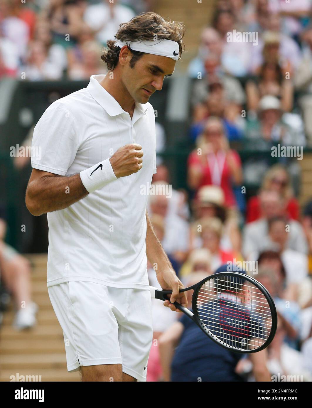 Roger Federer of Switzerland pumps a fist after winning a point