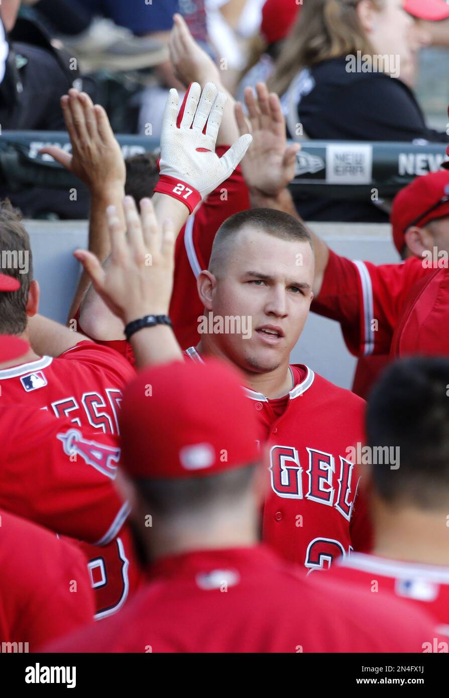 Los Angeles Angels' Mike Trout, left, celebrates his threerun home run